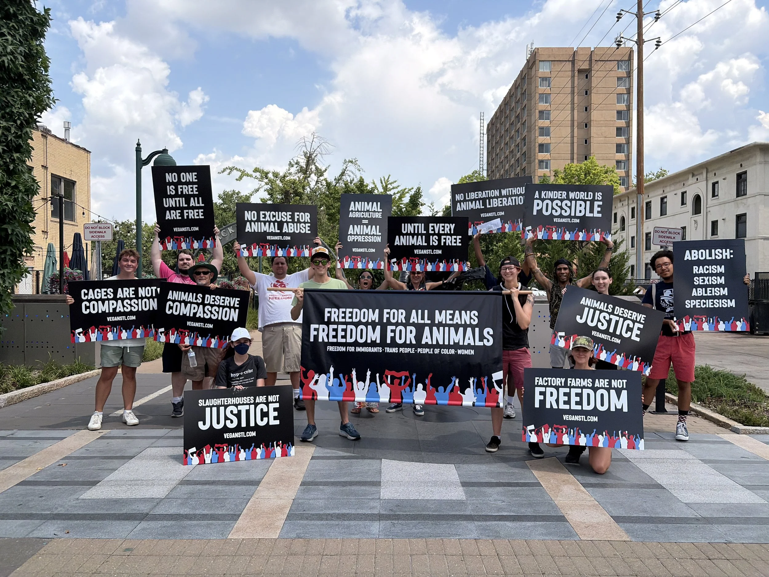 Vegan animal rights activists posing near the Chuck Berry statue along the Delmar Loop at our Animal Freedom March