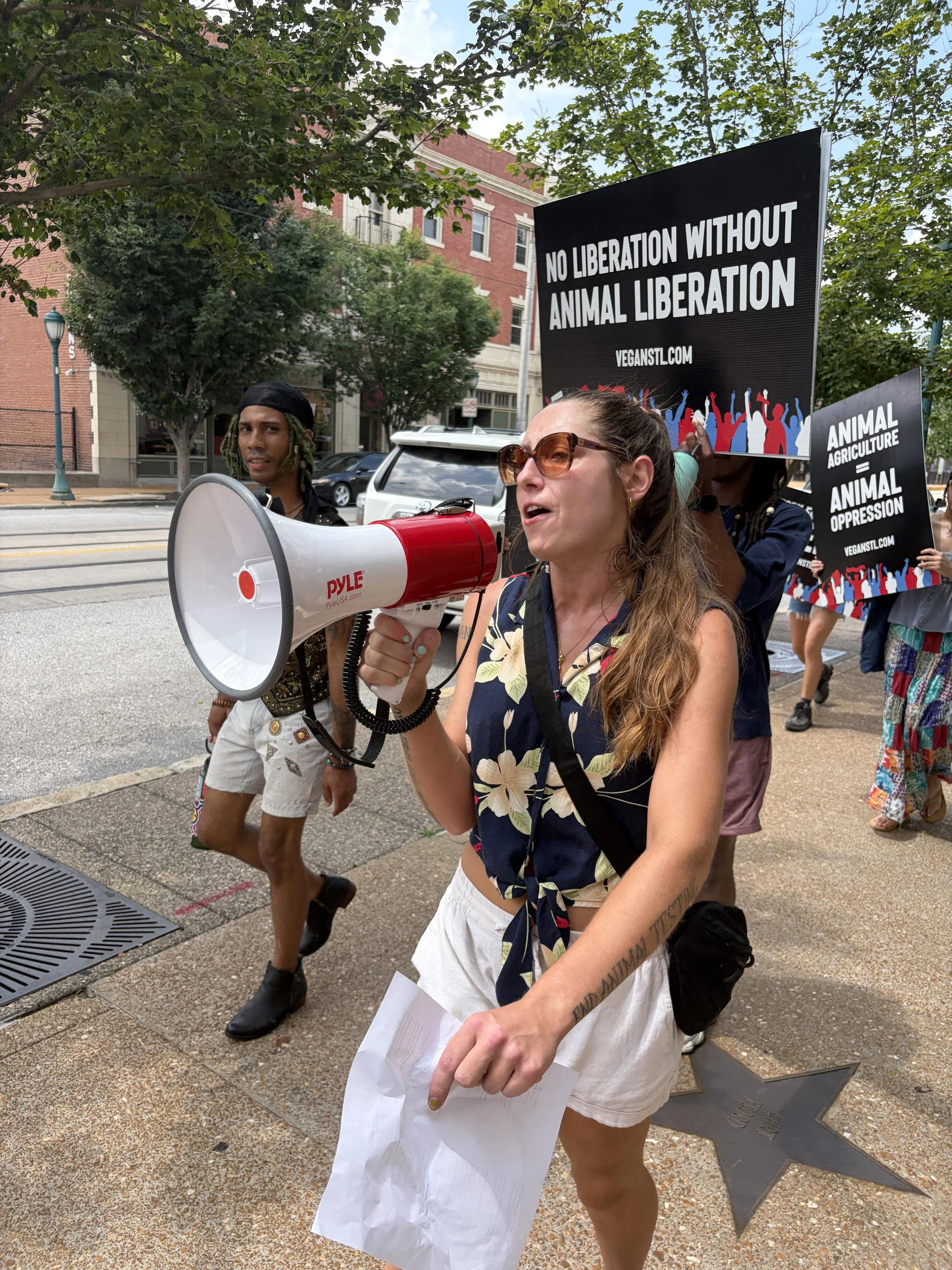 Vic leading protest chants with a megaphone during our Animal Freedom March along the Delmar Loop