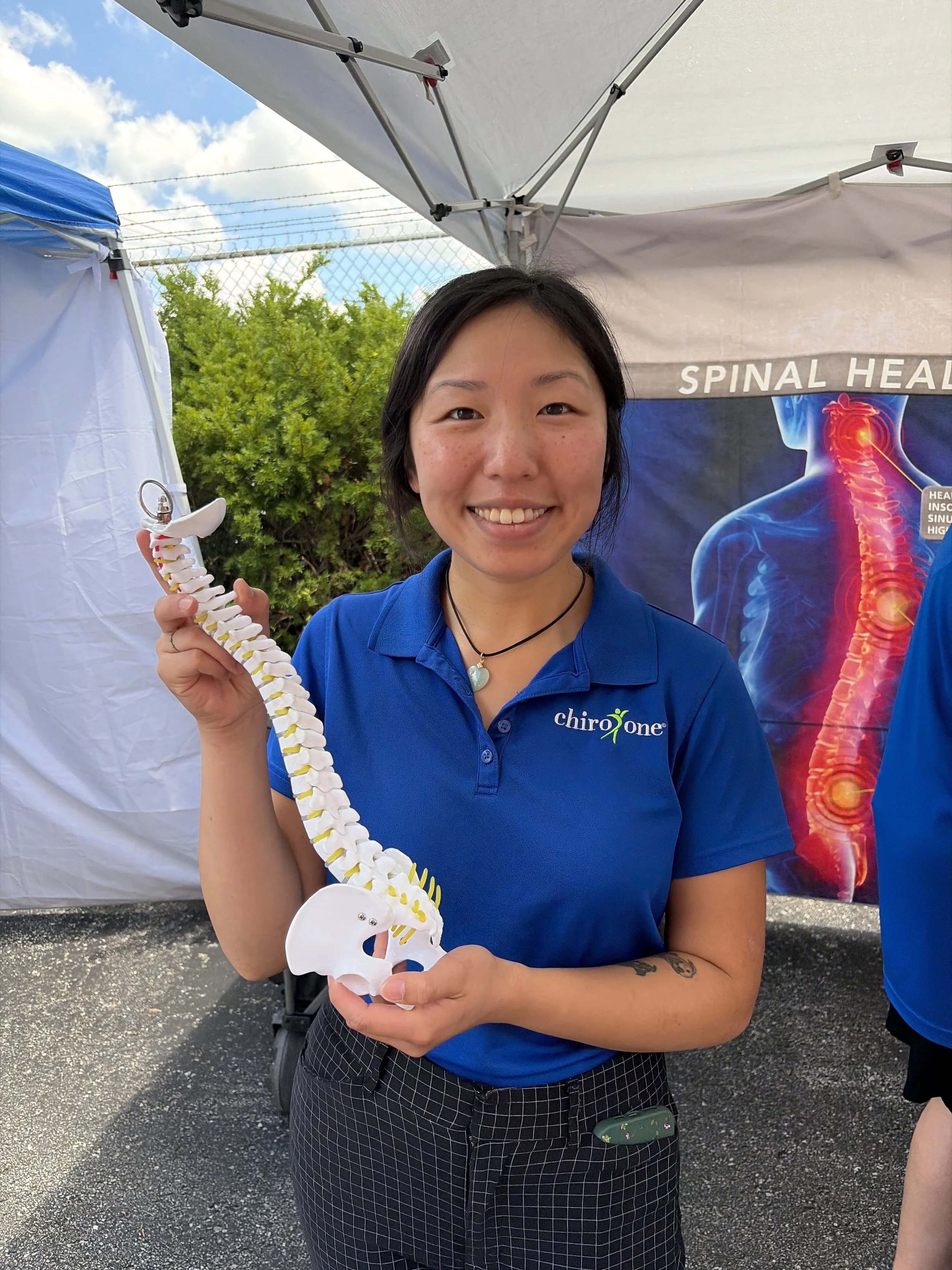Employee from Chiro One poses for a photo at the Vegan Block Party at Bougie Bites in St. Louis, Missouri.jpg