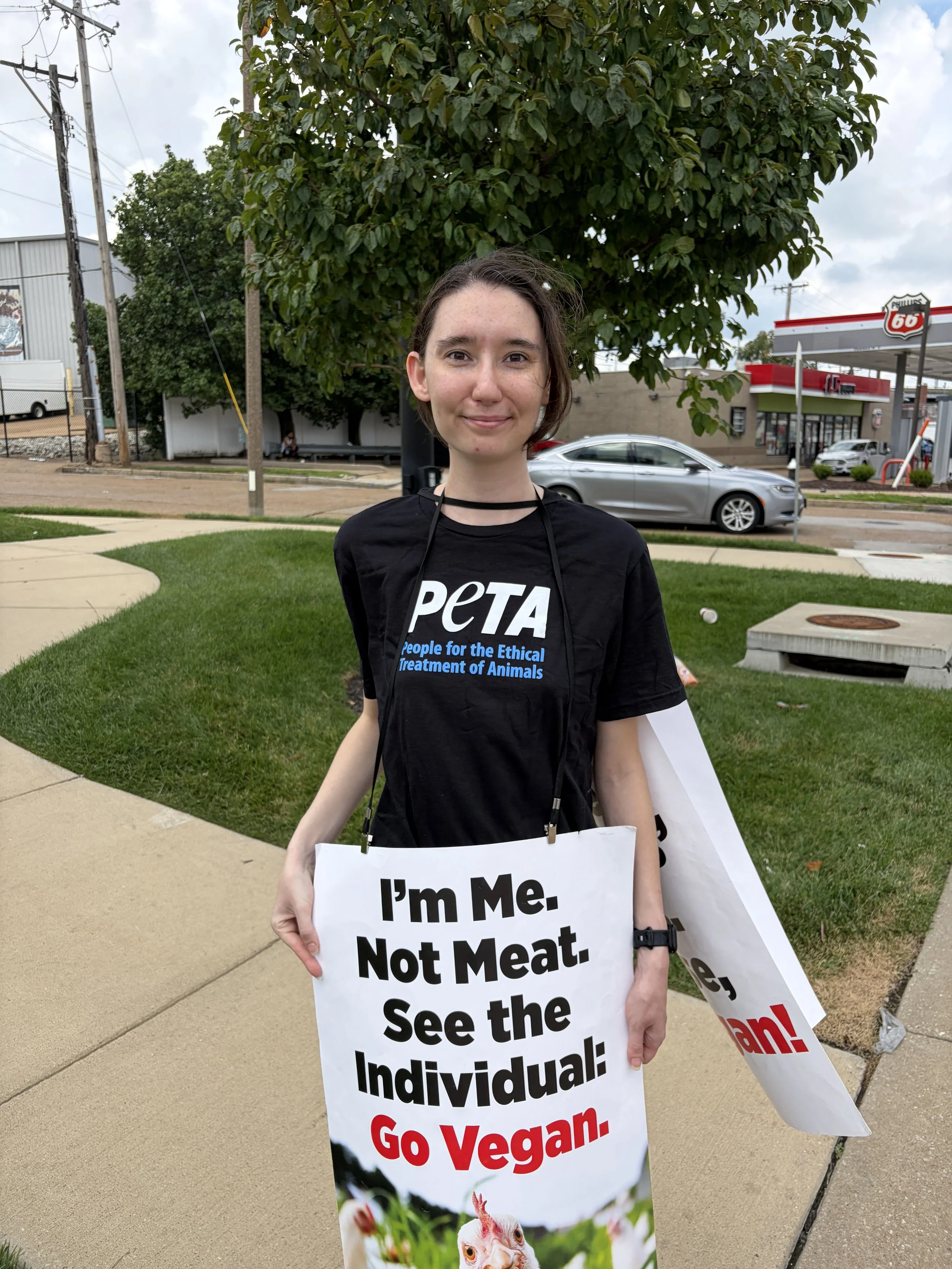 Murphy smiles with a PETA shirt at a Raising Cane_s protest in St. Louis, Missouri.jpg