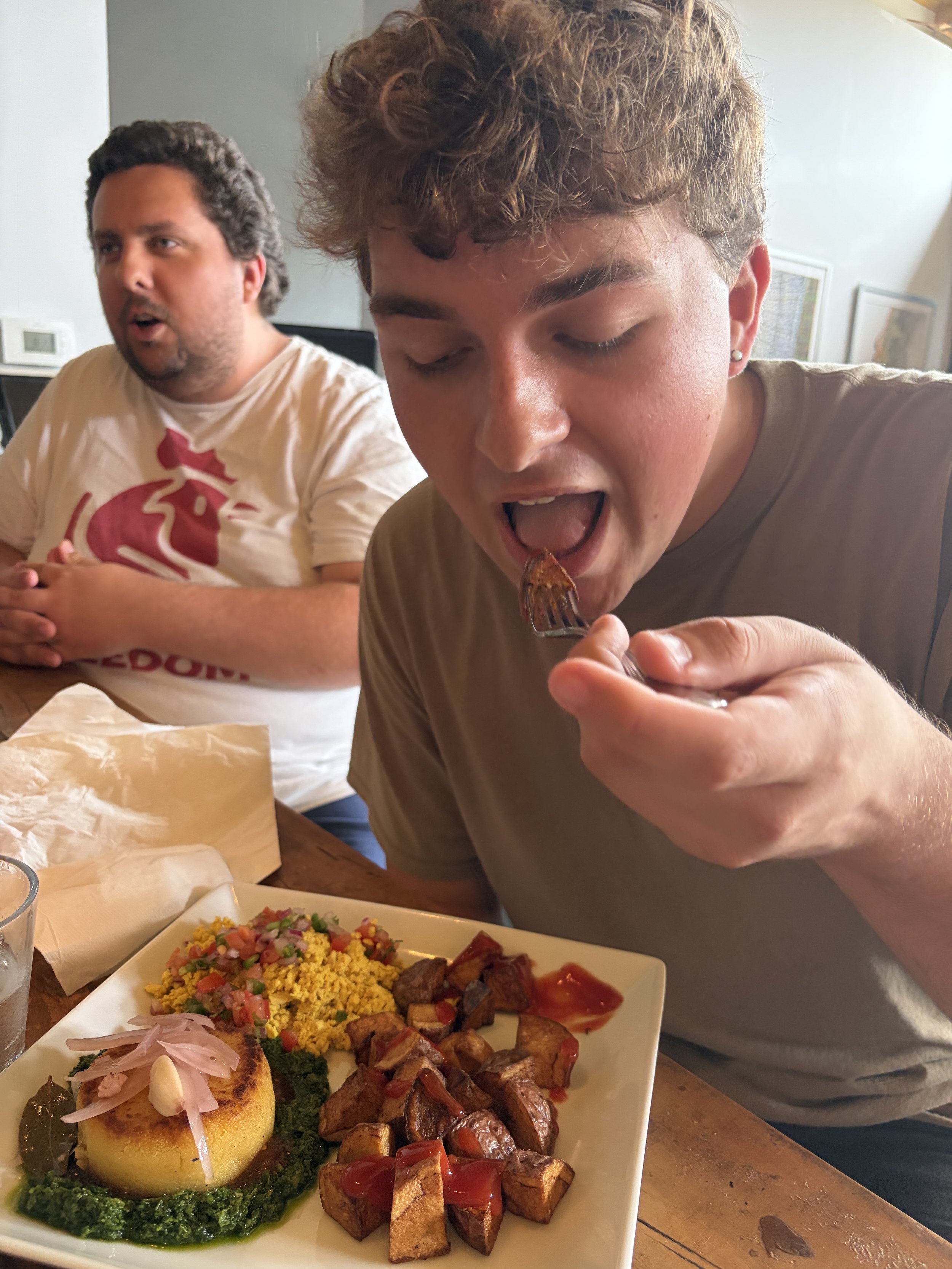 Troy, St. Louis Coordinator, enjoys breakfast potatoes at Vegan Brunch @ Tree House in St. Louis, Missouri.png