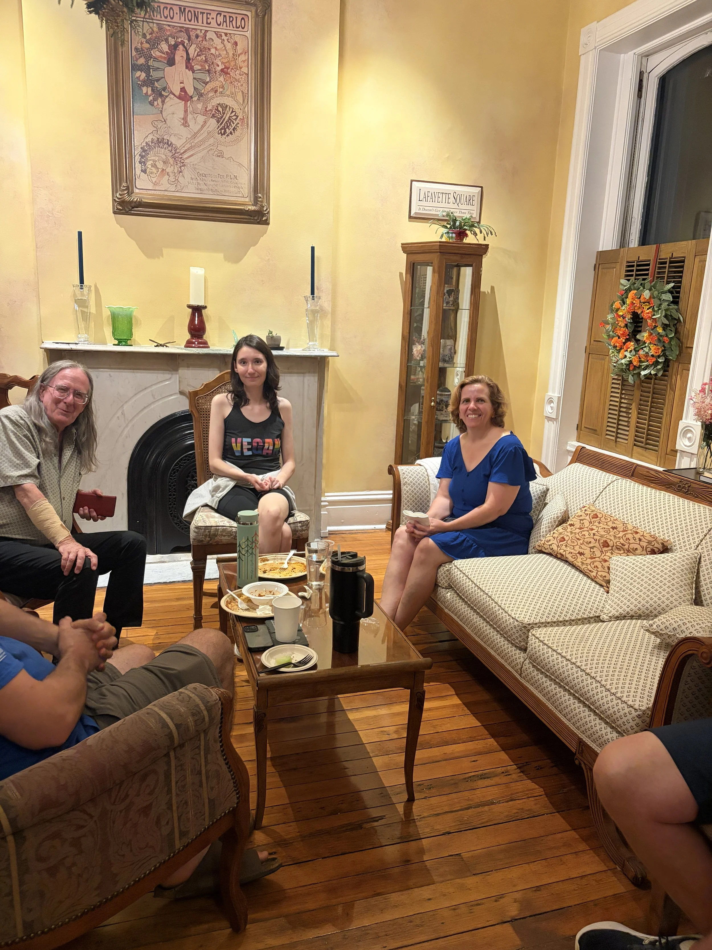 Al, Murphy, and Jenna take a photo in sitting room at Plant Lovers Potluck in St. Louis, Missouri.png