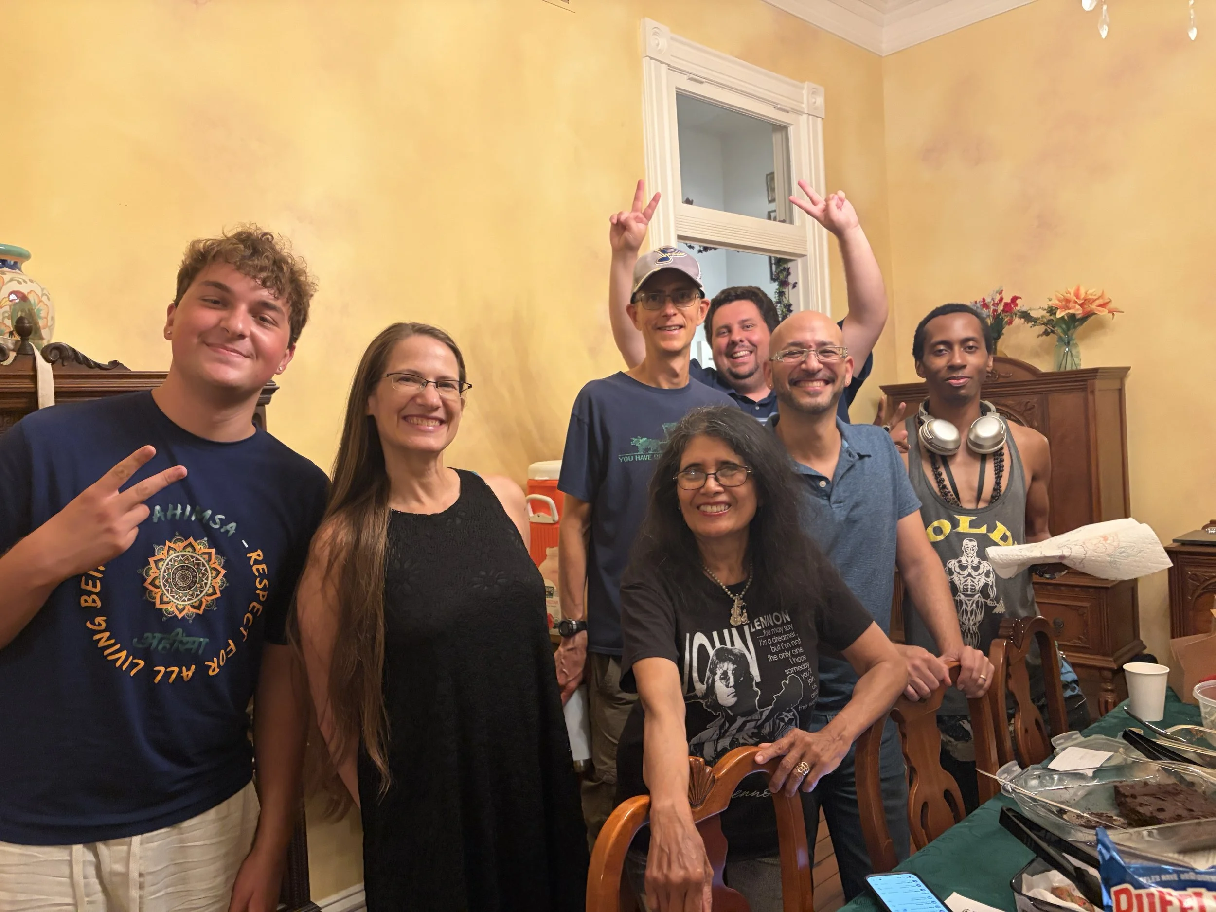 Guests, hosts, and volunteers pose for a photo at end of Plant Lovers Potluck in St. Louis, Missouri.png