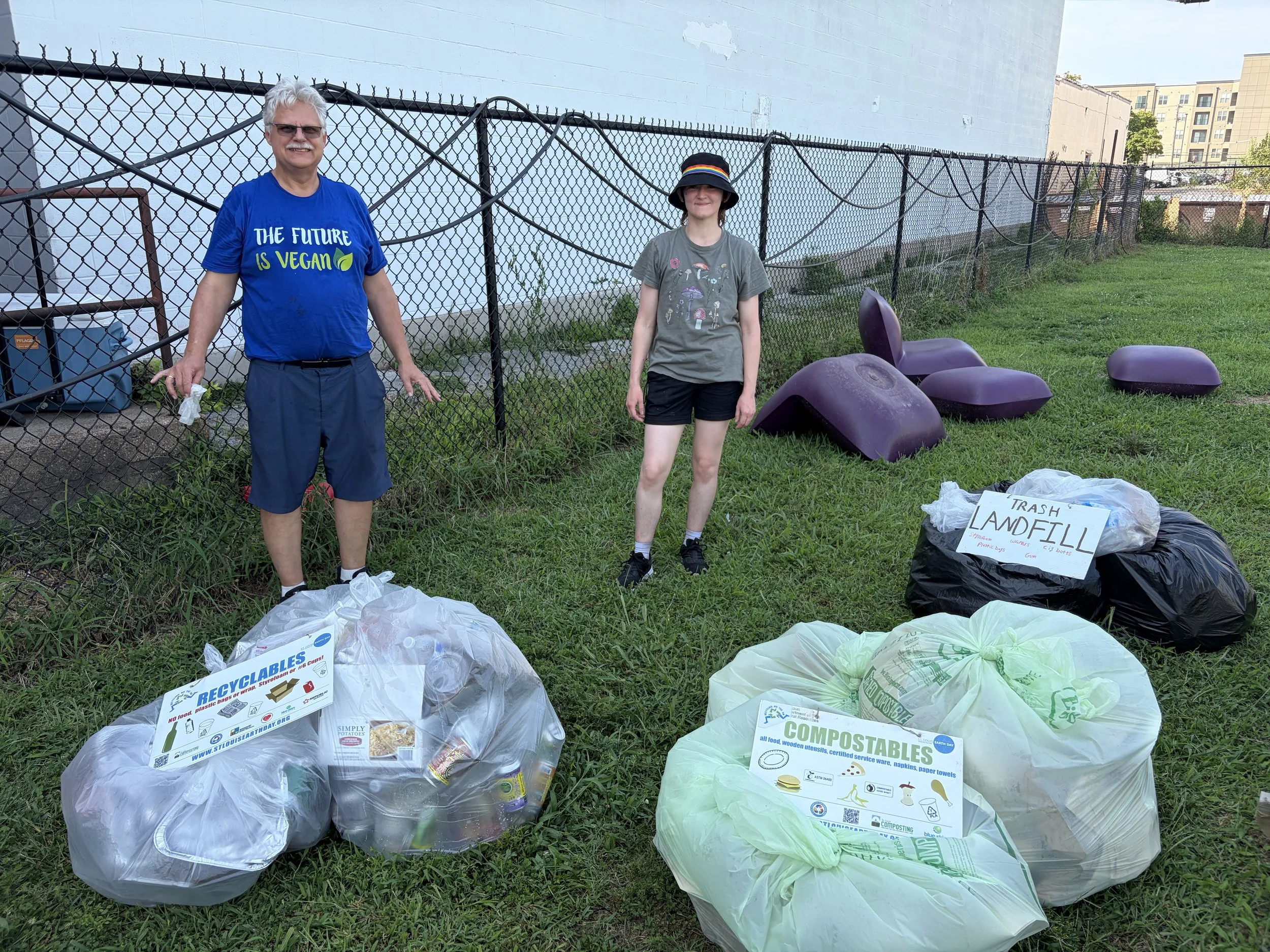 John and Hannah celebrate organized bags of waste to be composted and recycled at STL Vegan Market in St. Louis, Missouri.png