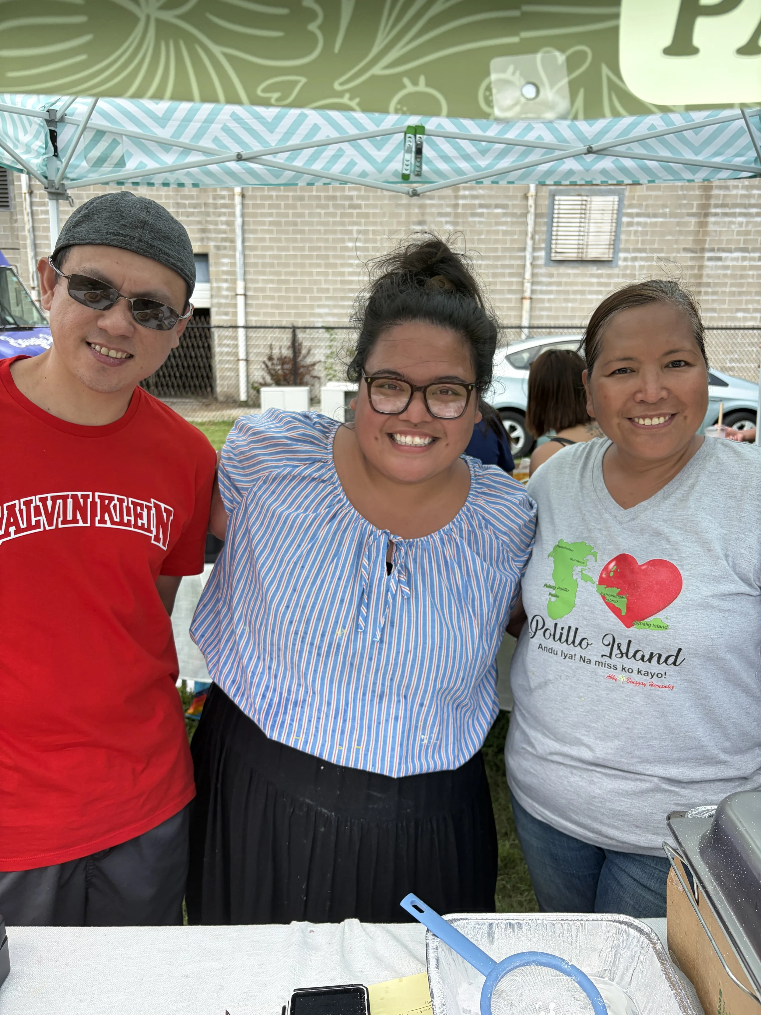 Close-up of employees and owner of Abby_s Vegan Delights at STL Vegan Market in St. Louis, Missouri.png