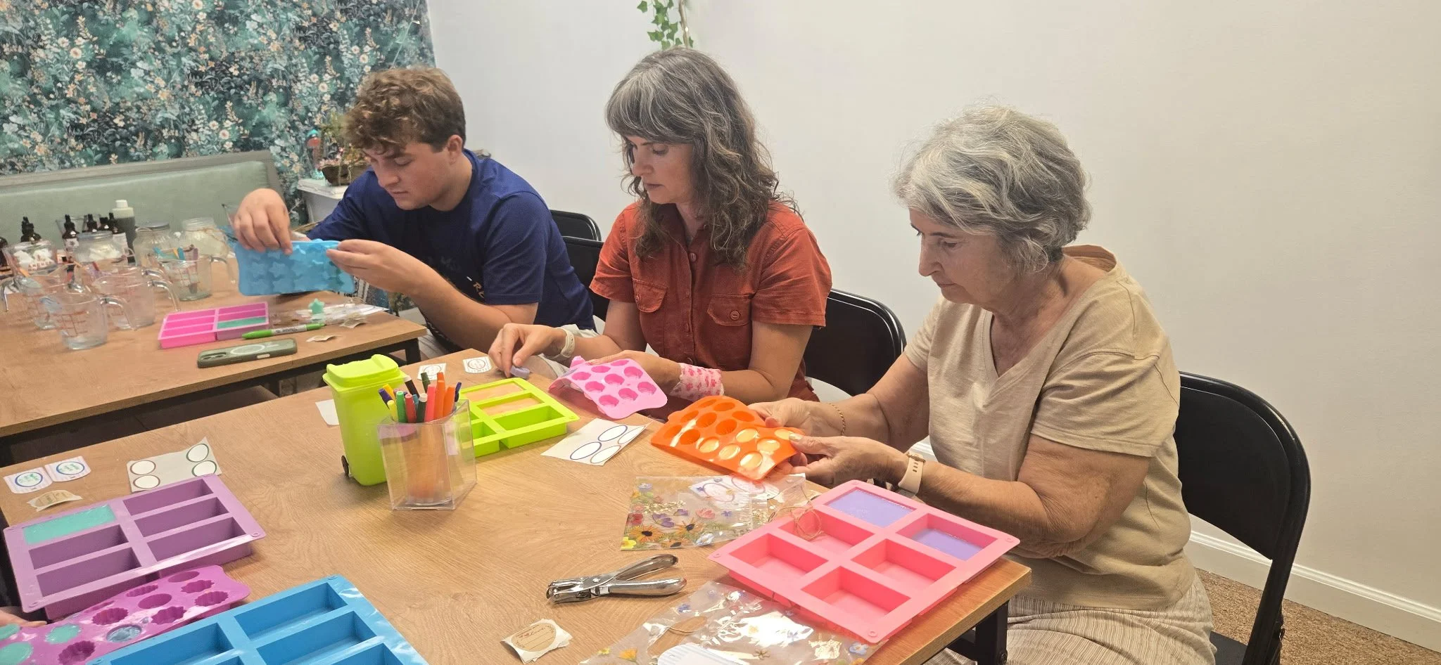 Attendees begin to remove their vegan soaps from molds at Life and Styles Vegan Soap-Making Class in St. Louis, Missouri.png