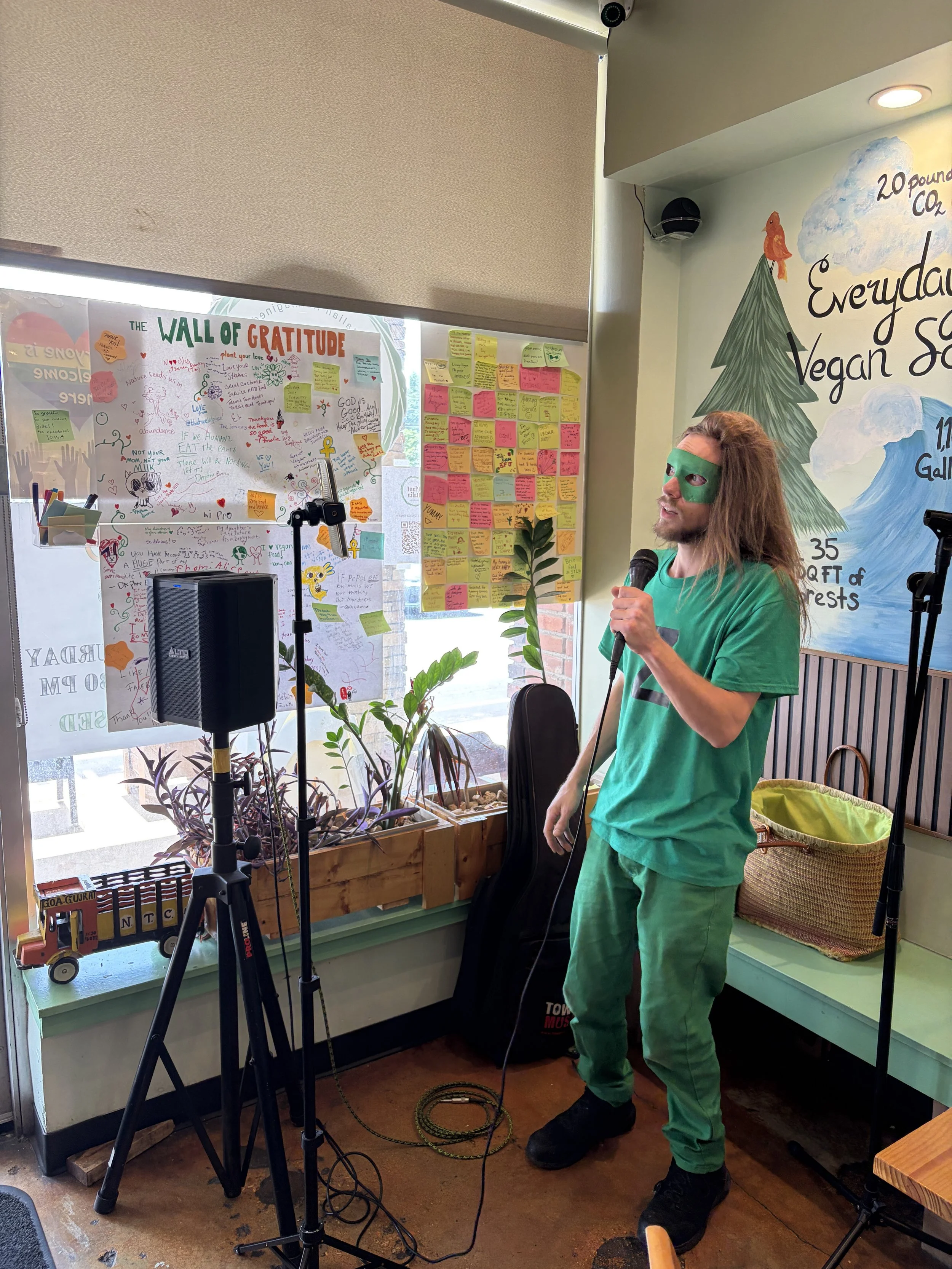 ZManTheVegan performs live at Vegan Ice Cream Social at Bombay Food Junkies in St. Louis, Missouri.png
