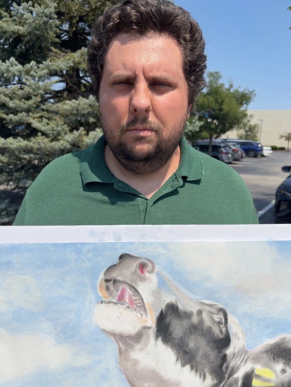 Kyle holds a Where Is My Baby sign at Dairy Is Scary Protest at Culver_s in St. Louis, Missouri.png