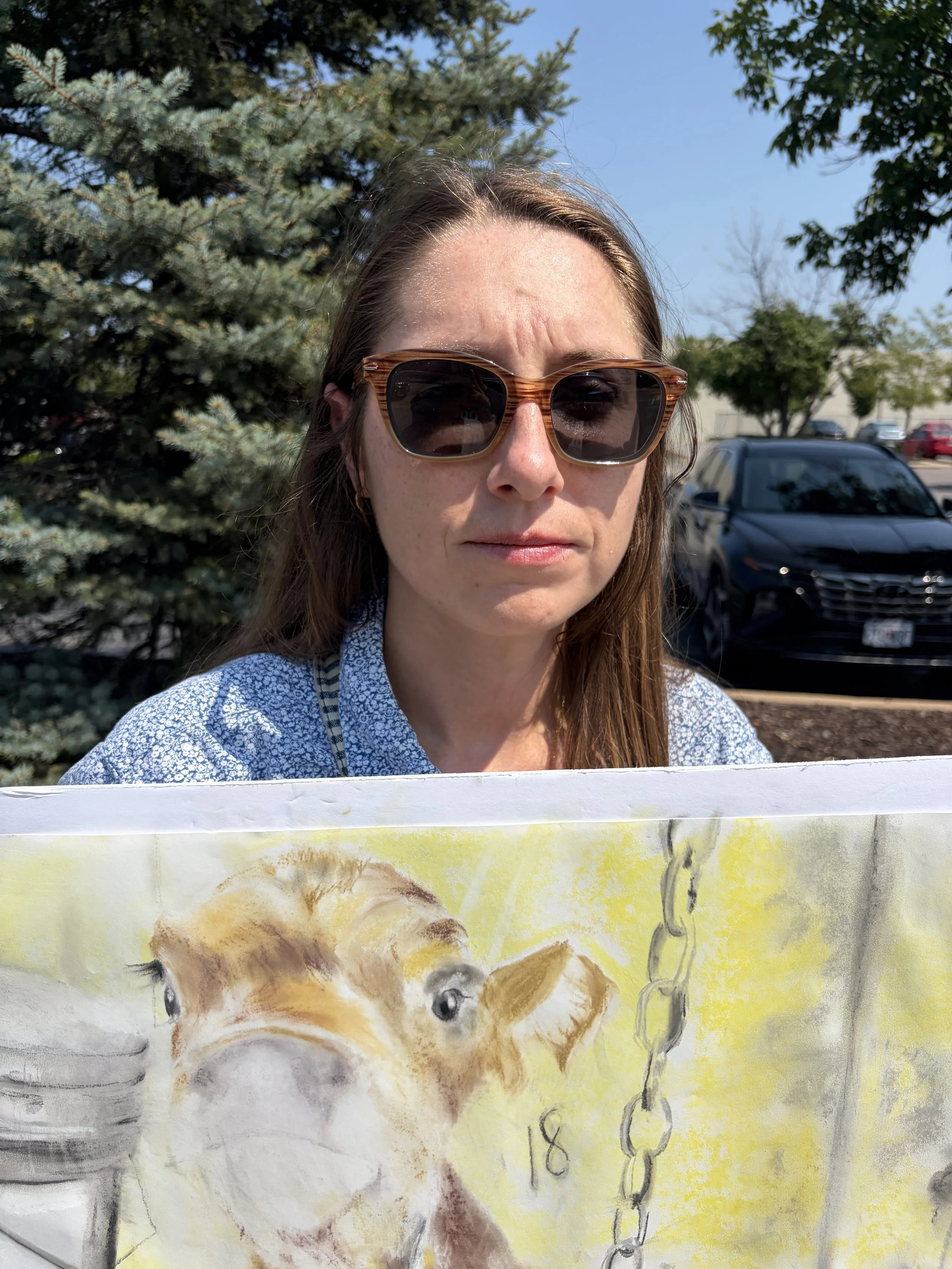Vic, an animal rights activist, holds up a sign at Dairy Is Scary protest at Culver_s in St. Louis, MIssouri.png