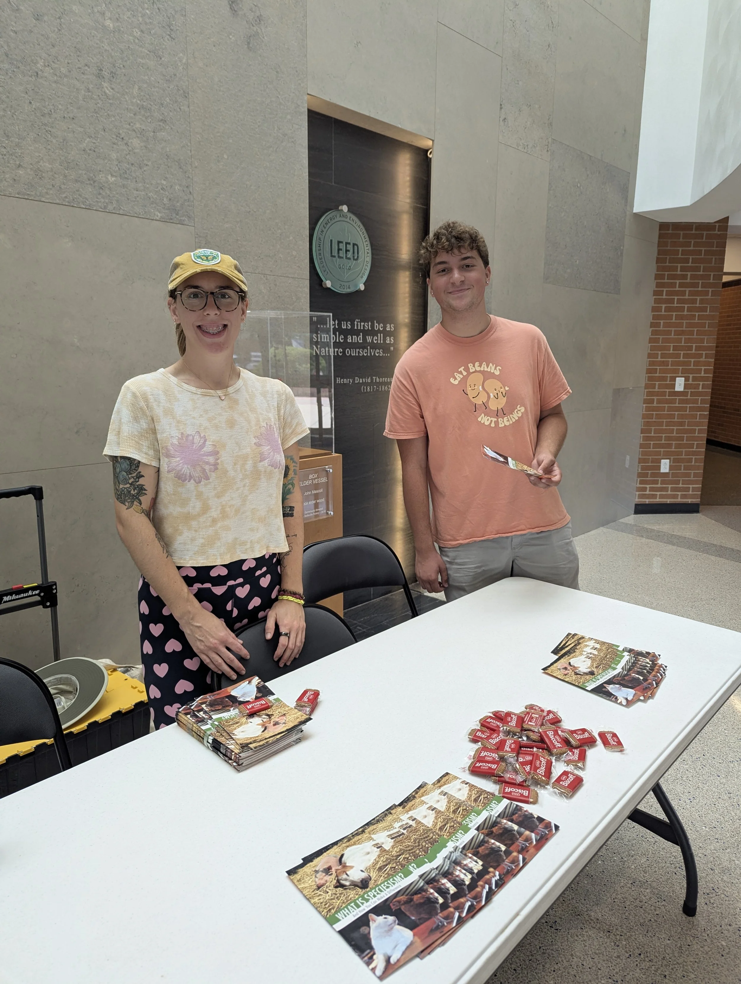 Autumn and Troy happily table inside building at Southwestern Illinois College in Belleville, handing out hundreds of pamphlets.png