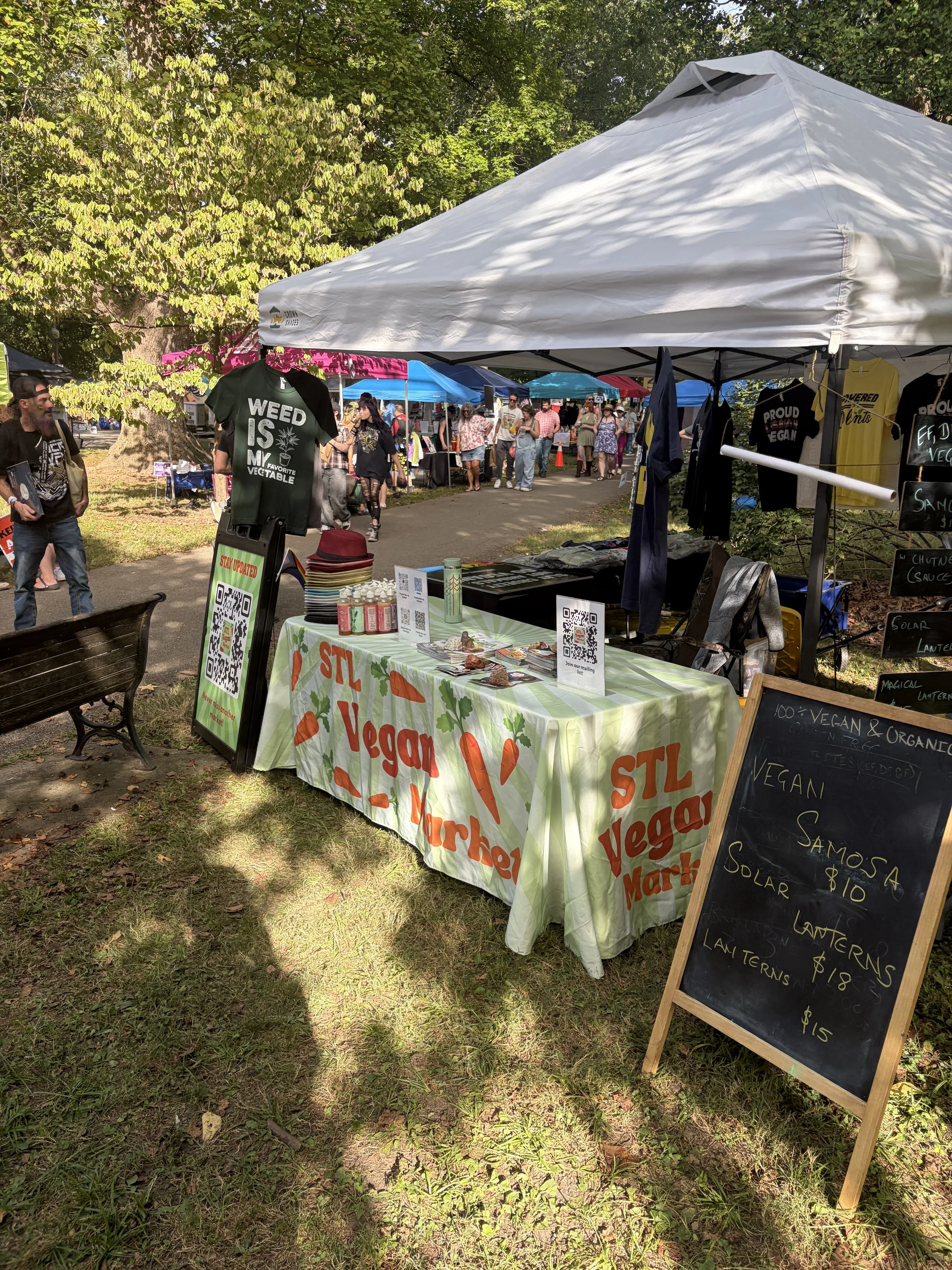 Organized and decorated booth for Vegan Pride Booth at Tower Grove Pride in St. Louis, Missouri.png