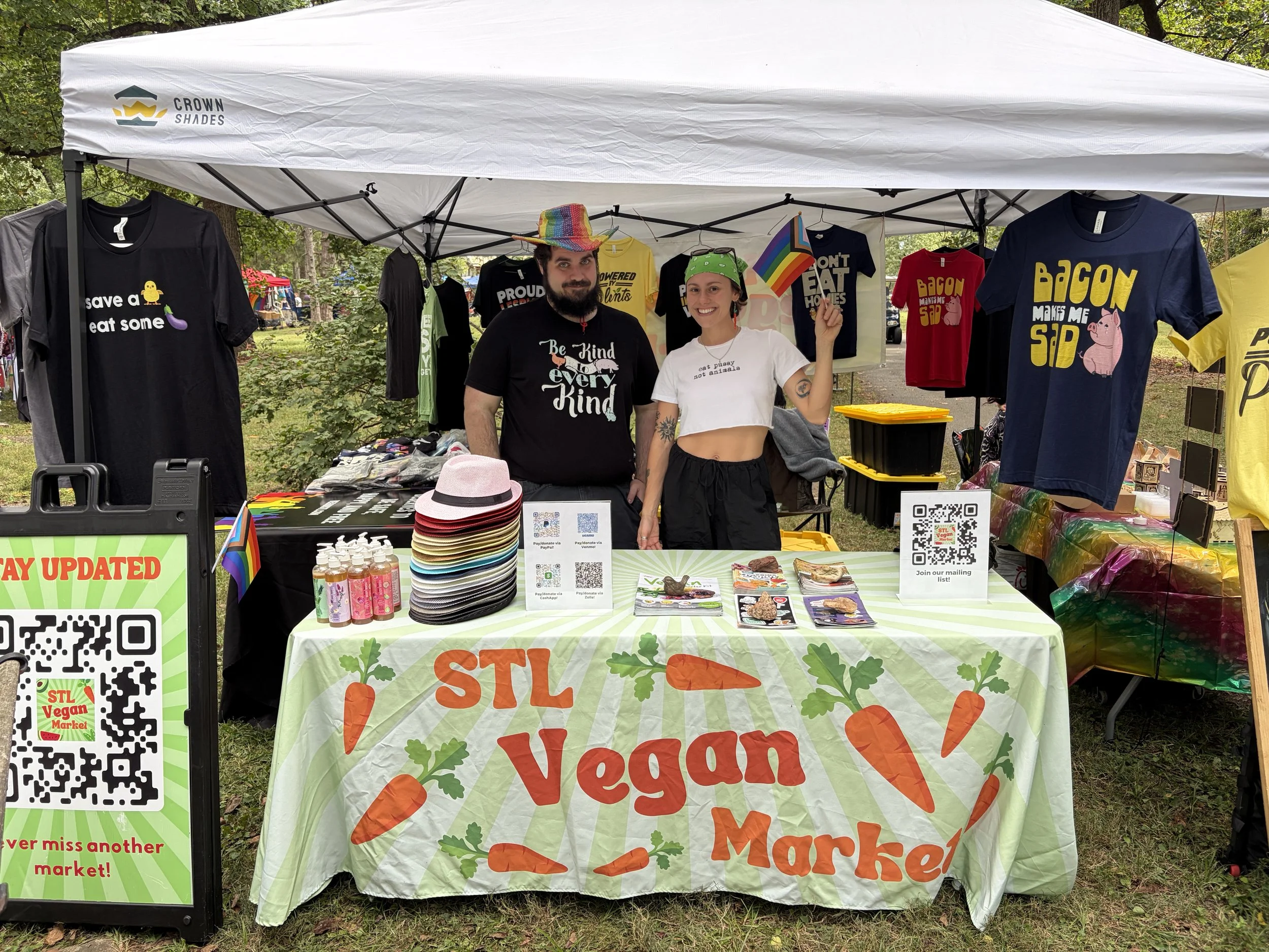 Alex and Jade proudly run booth for Vegan Pride Booth at Tower Grove Pride in St. Louis, Missouri.png