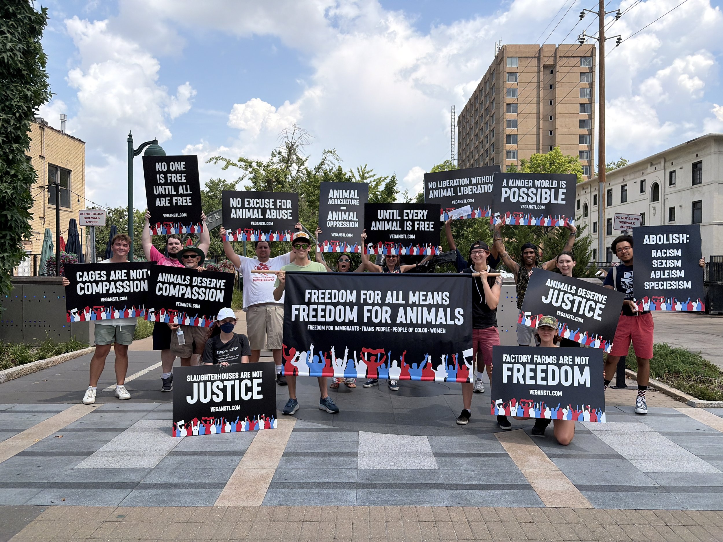 Vegan animal rights activists posing near the Chuck Berry statue along the Delmar Loop at our Animal Freedom March