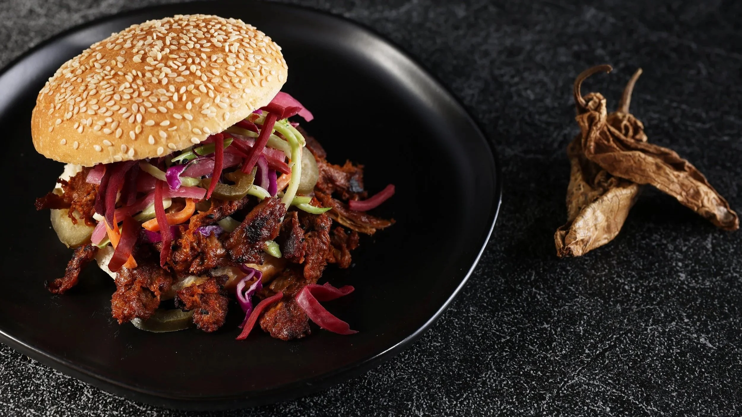 Harvest Shreds plant-based protein featured in a decadent sandwich