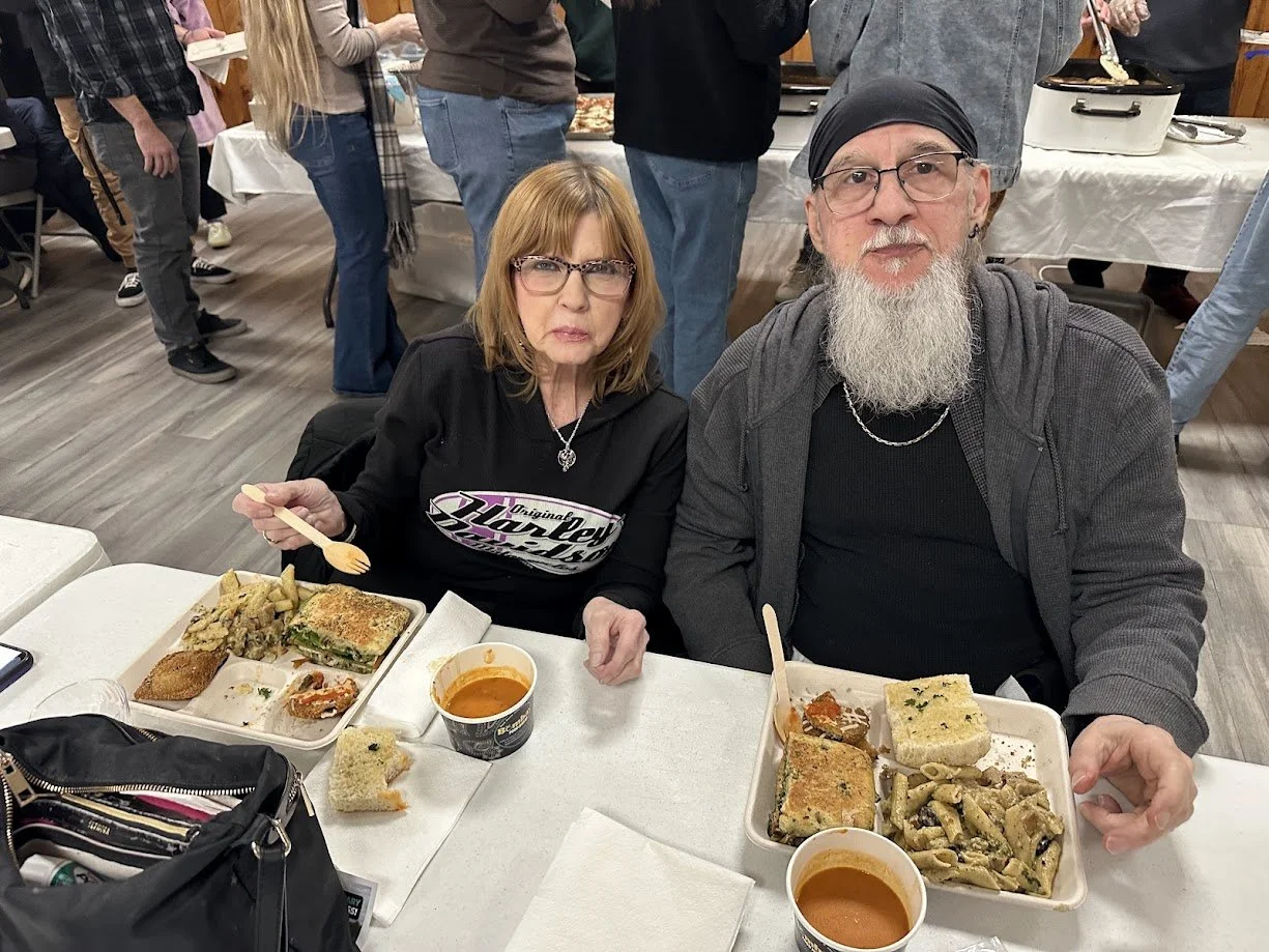 A couple with vegan Italian food at our Plant Italia Dinner at American Legion Post 111 in Shrewsbury, Missouri