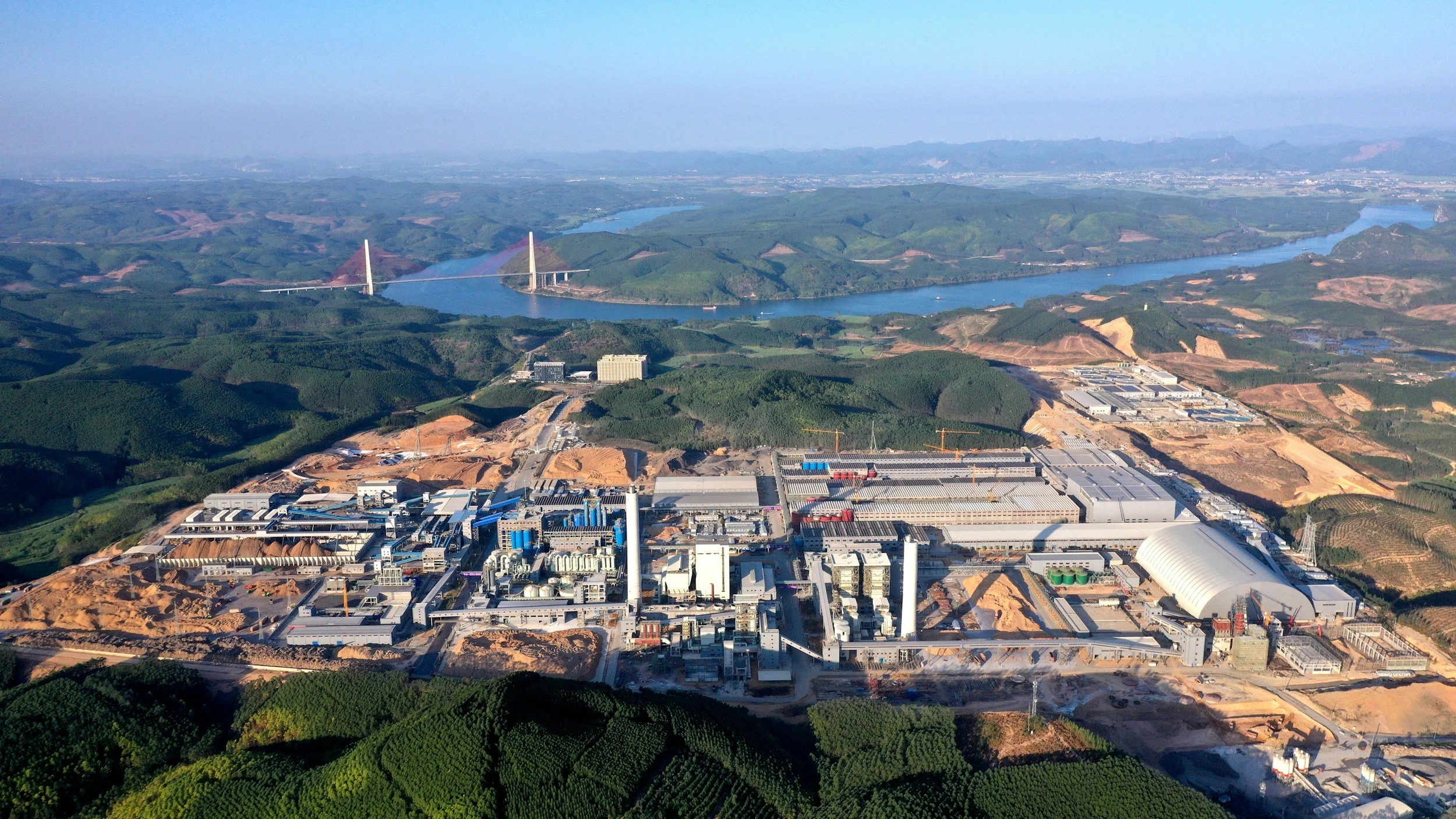 Aerial view of low-rise commercial and industrial buildings with surrounding green space
