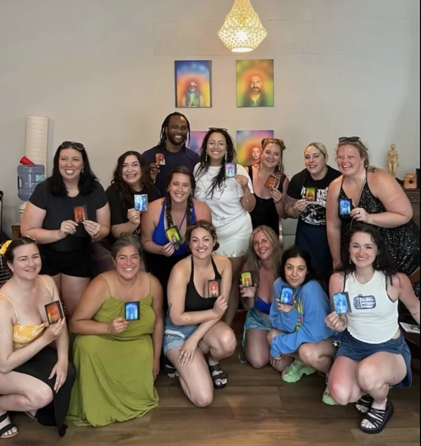 Large group of people holding their aura photos in the Chicago studio.