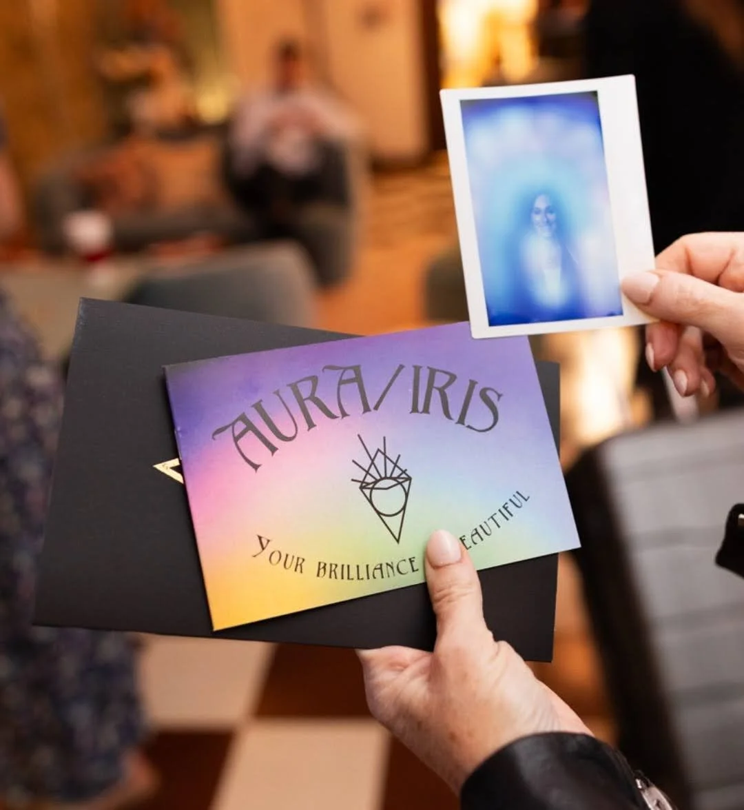 Person holding Aura/Iris card that you receive with your image.