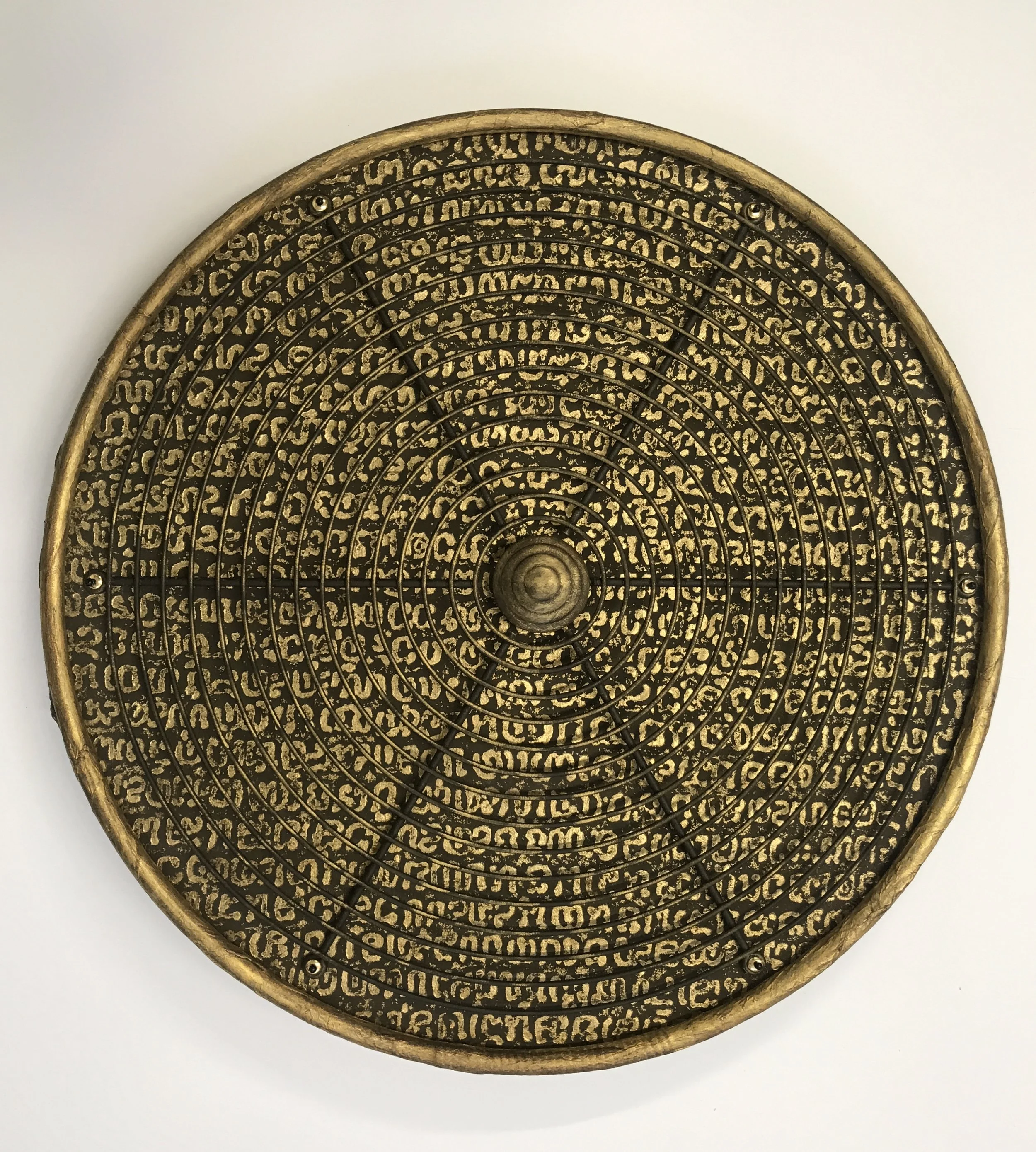 ENIGMA - Handmade paper pulp, printed handmade paper, plastic ring, metal grid, wood drawer pull, beads, pins. (23”diameter x 3”d)