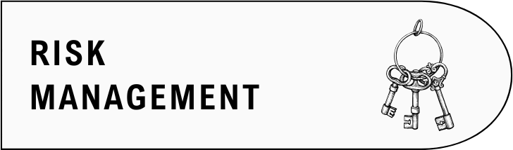 A sign with the words 'RISK MANAGEMENT' and a keychain with three keys attached.