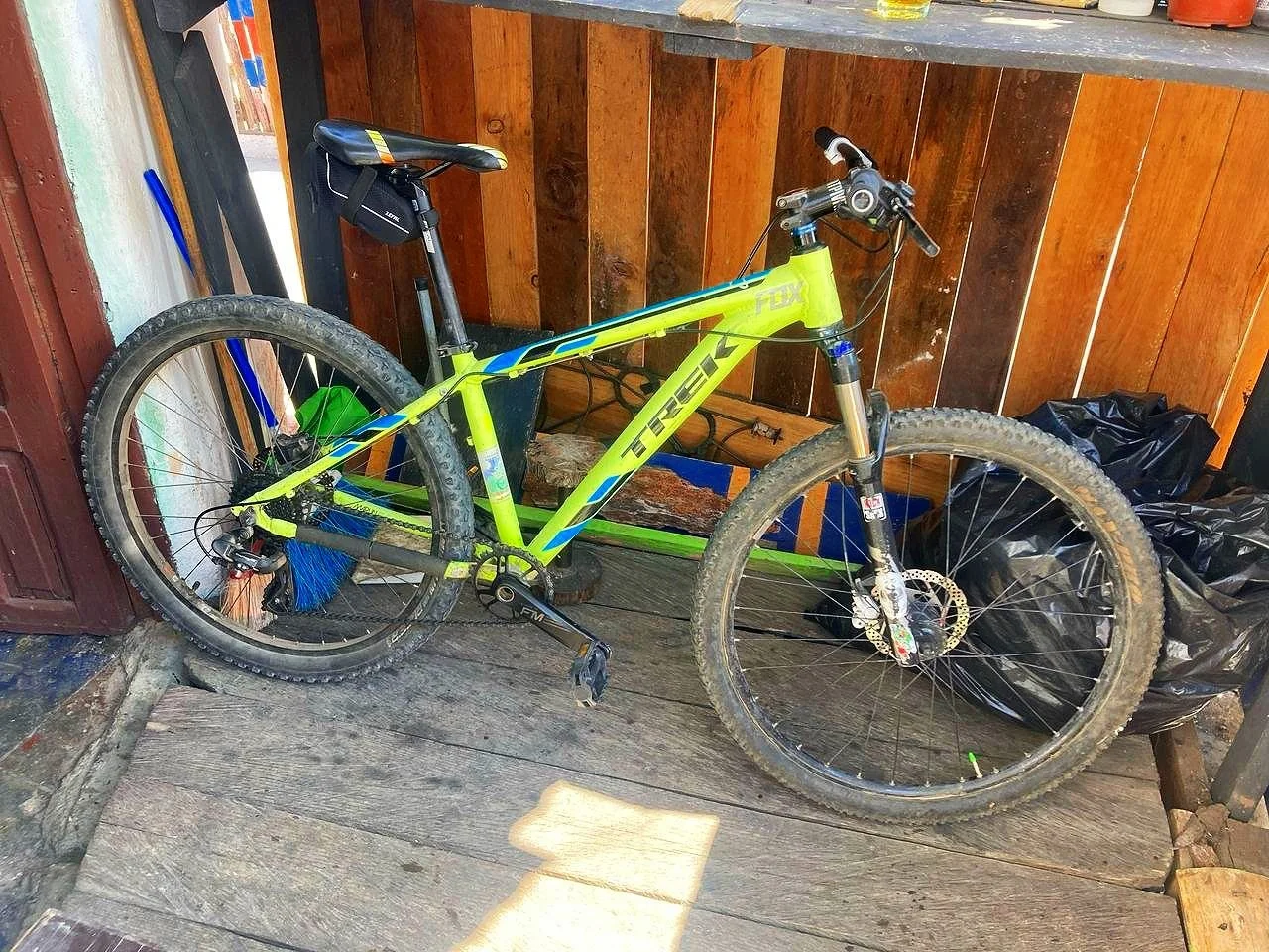 Mountain bike leaning against a wooden wall