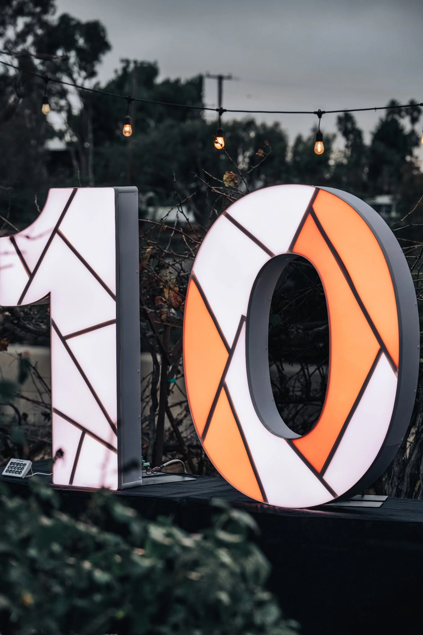 10 marquee numbers displayed at a corporate anniversary event in Orange County