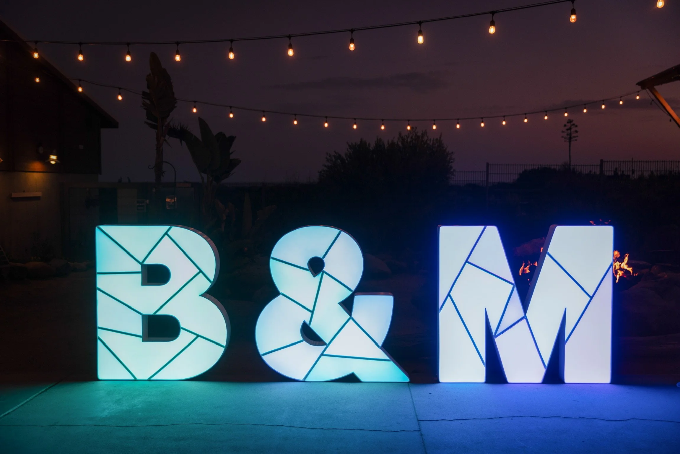 Illuminated marquee letters at an evening event with custom color lighting in Orange County