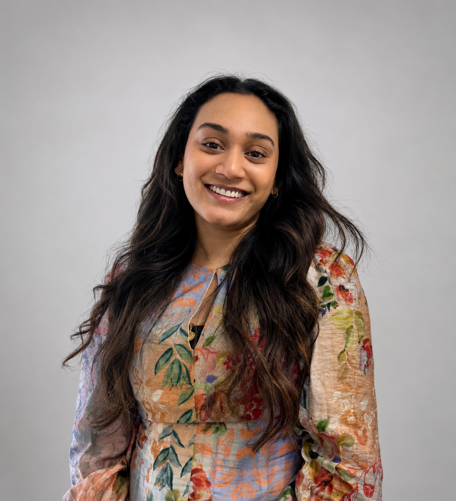 Woman in colourful dress smiling in a friendly manner