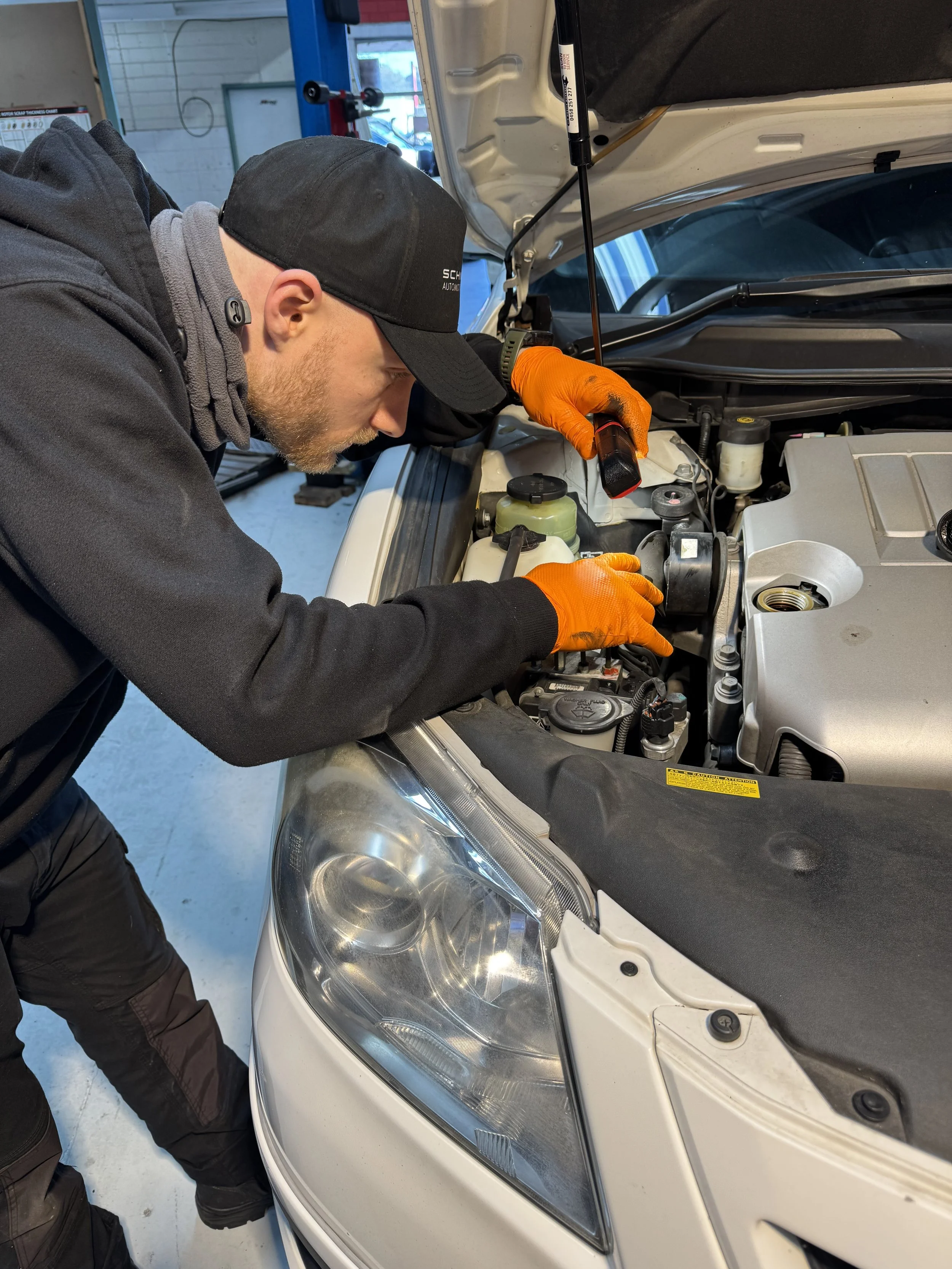 Schneidx Auto Care’s detail-oriented technicians meticulously working on a vehicle in Clayton South, VIC 3169 – precision and care in every repair