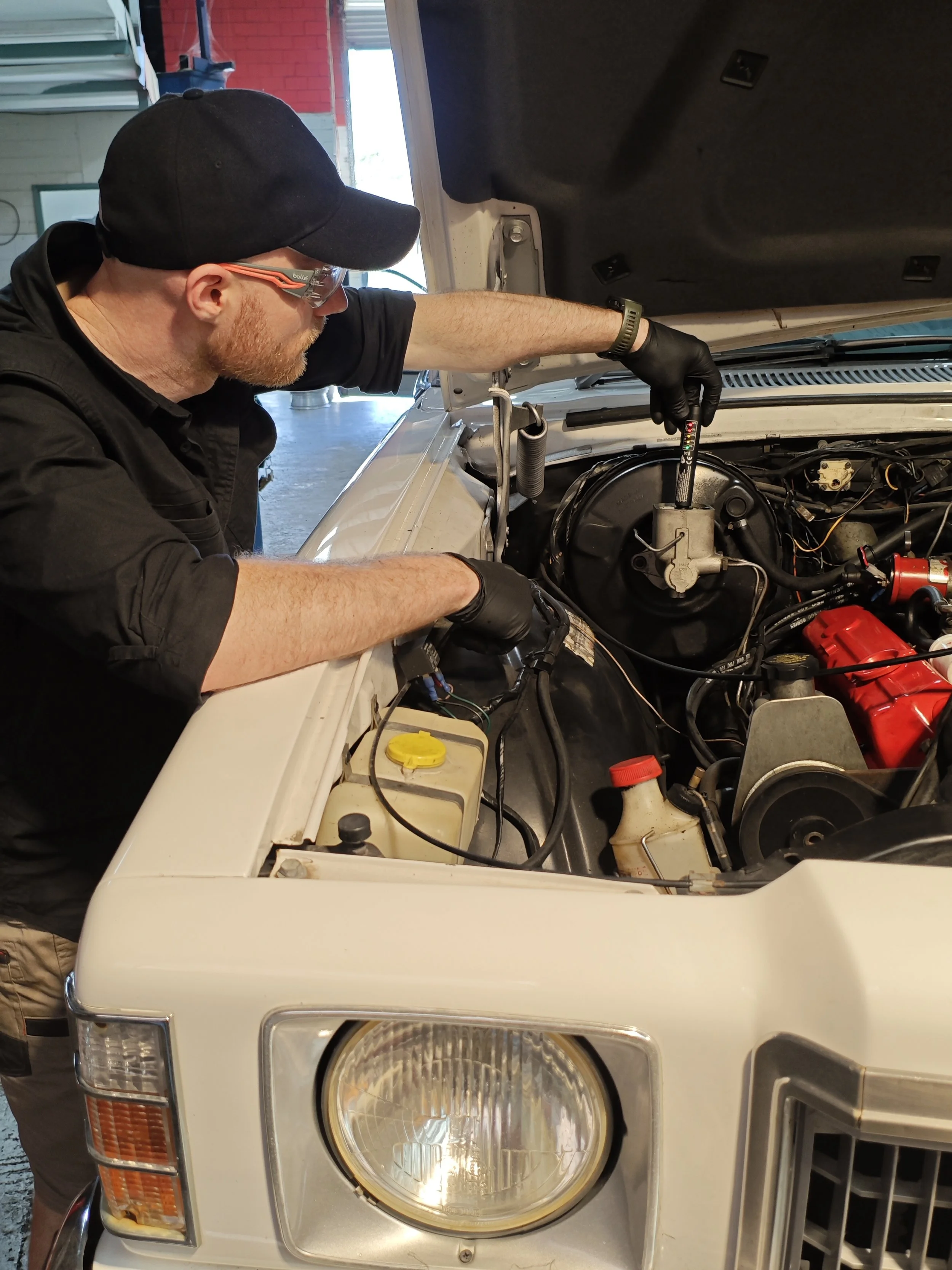 Expert mechanic in clayton south performing vehicle diagnostics, victoria Australia.