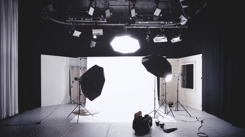 professional photography studio setup with lighting equipment and white backdrop