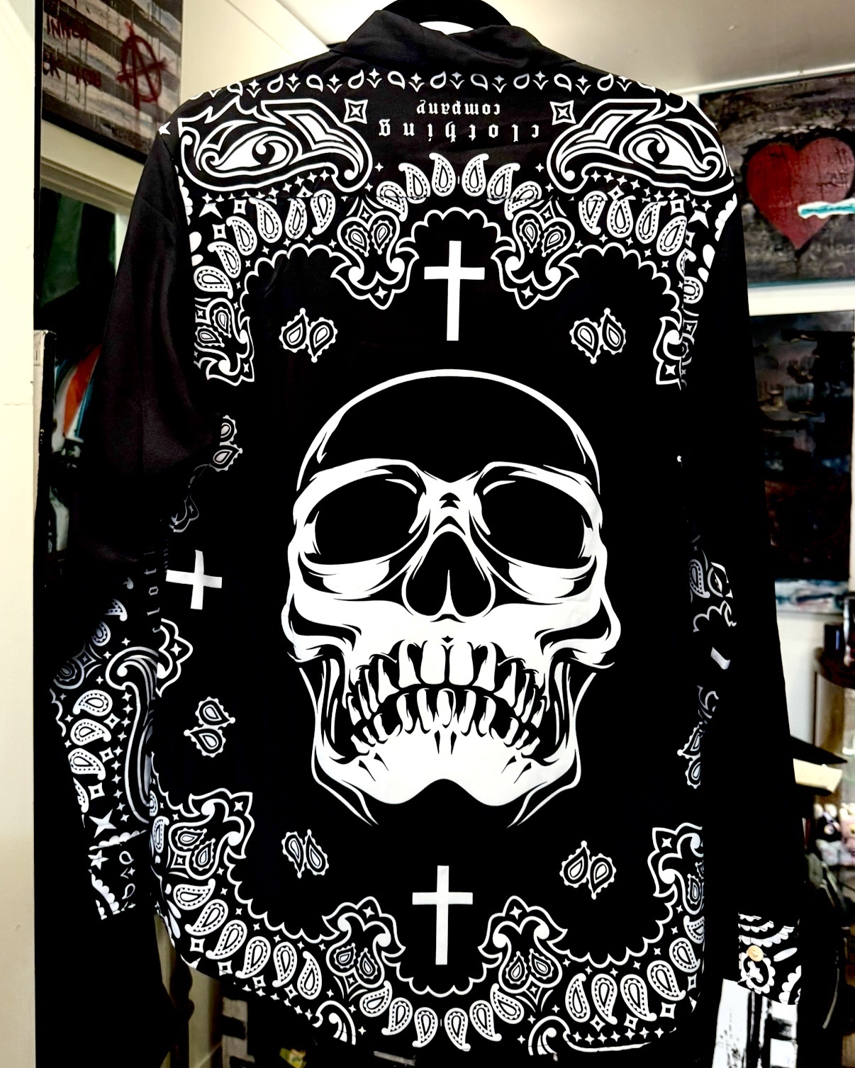 black and white bandit long-sleeved collared shirt with white skull and swirly pattern and white cross on top  inspired by Los Angeles street gang bandannas (back)