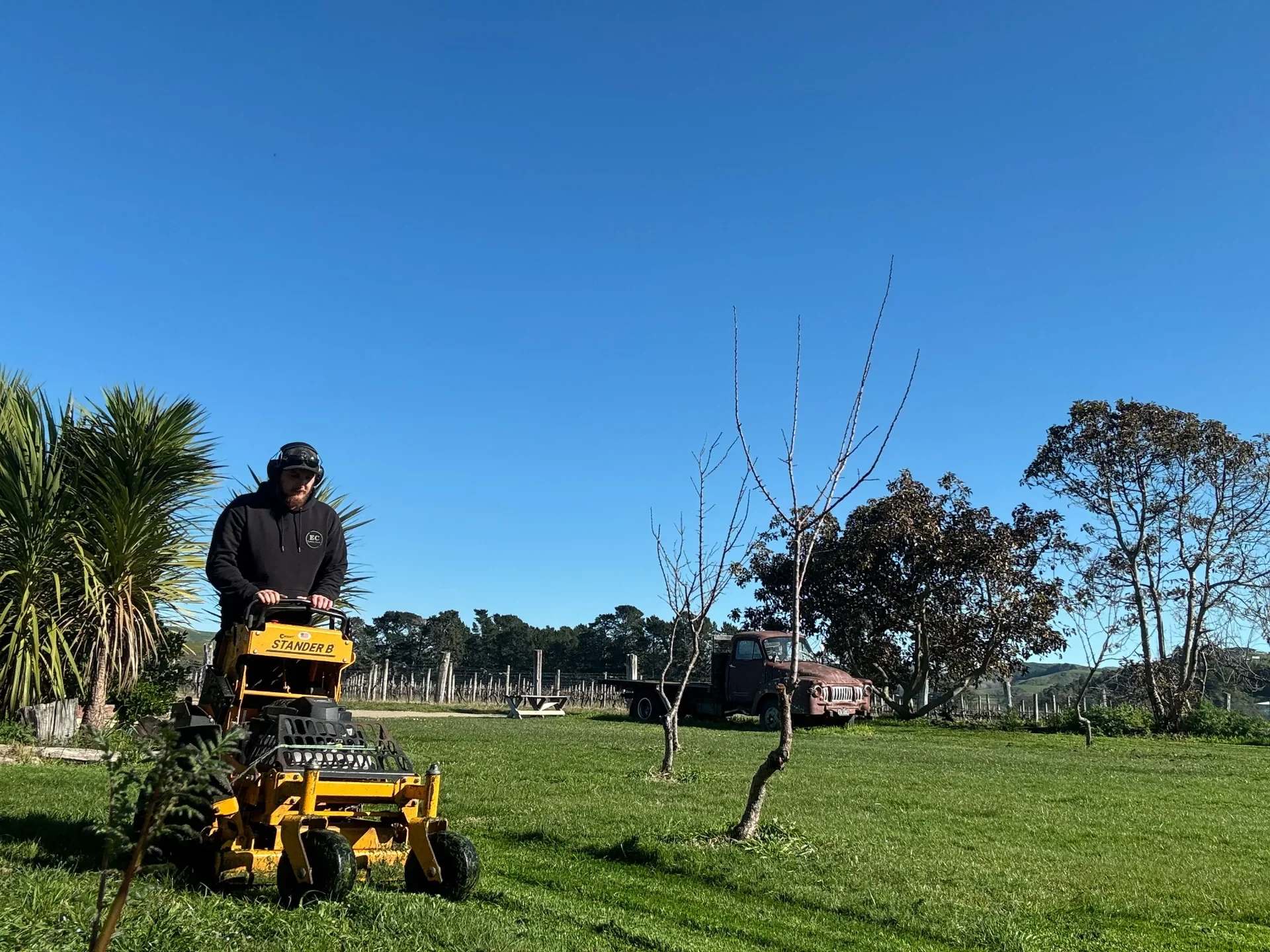 EC Lawn Care operator mowing a large commerical property in Hawke's Bay using a Wright Stander commercial mower.