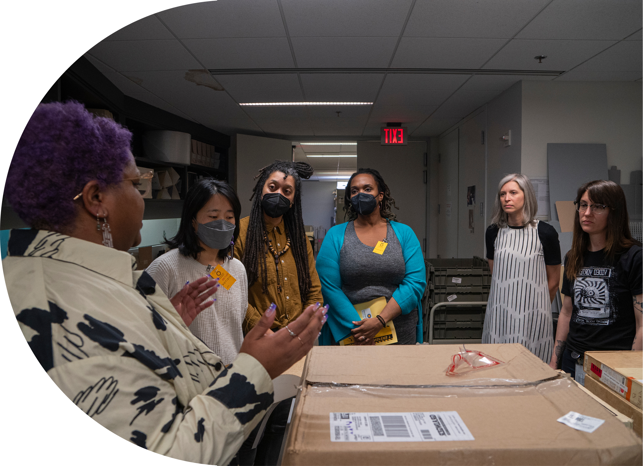 civic media fellows listen to an archivist speak about a collection