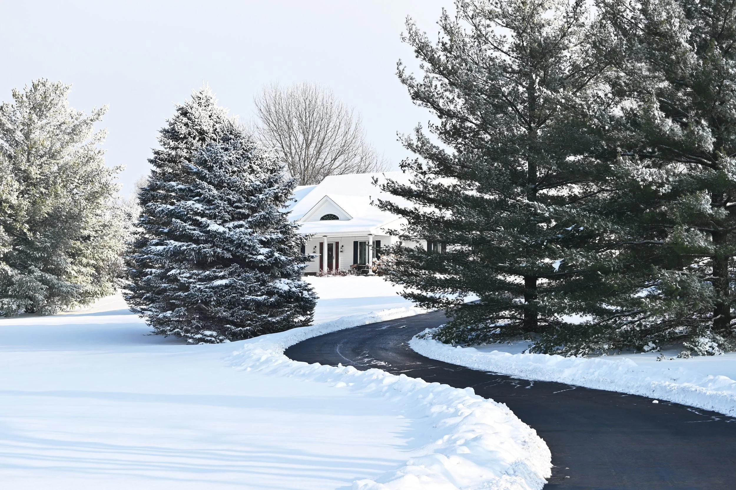 Snow Blowing vs. Plowing for Sloped and Curved Driveways
