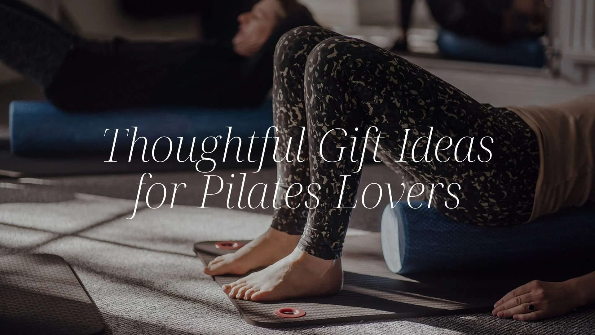 Women in class using Pilates foam roller