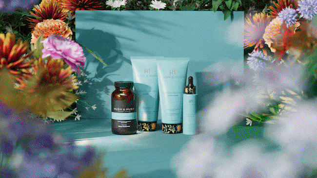 Beauty products with bottles and tubes on a floral backdrop.