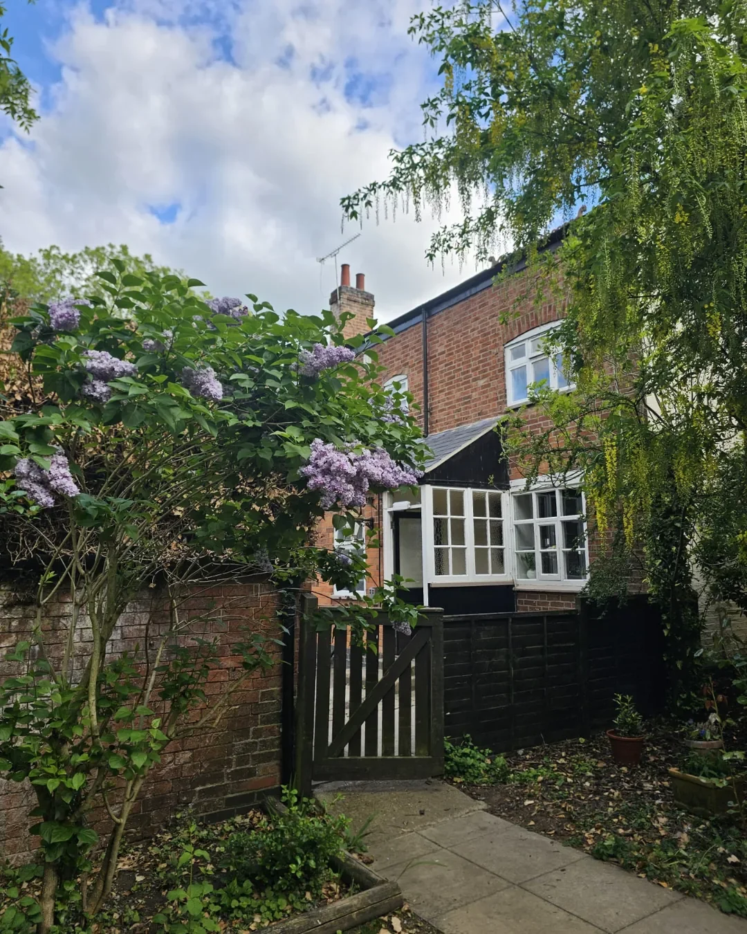 The Red Admiral country pub in Broughton Astley, Leicestershire, with wisteria and a weeping willow, venue for the Sojourn Summer Social Pilates event.