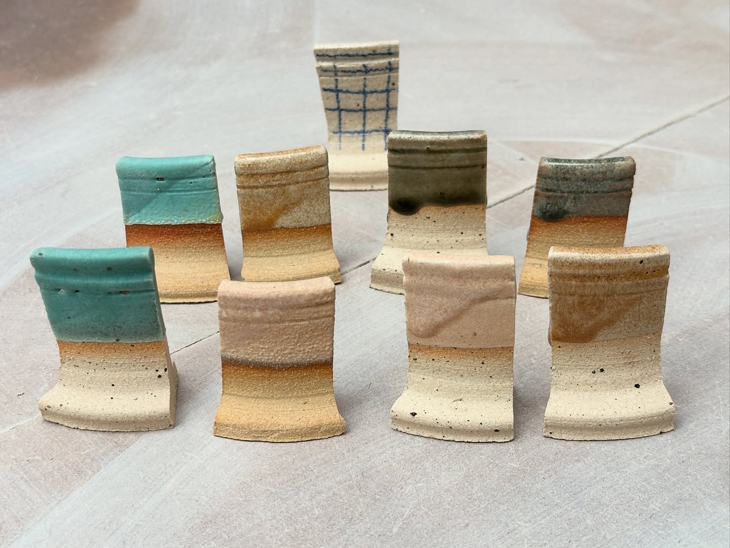 Finally making progress with my glazing choices! After testing out four different options, plus a simple underglaze pencil / transparent glaze combination, I got my test tiles back from the kiln yesterday. And while two of the glazes are probably not