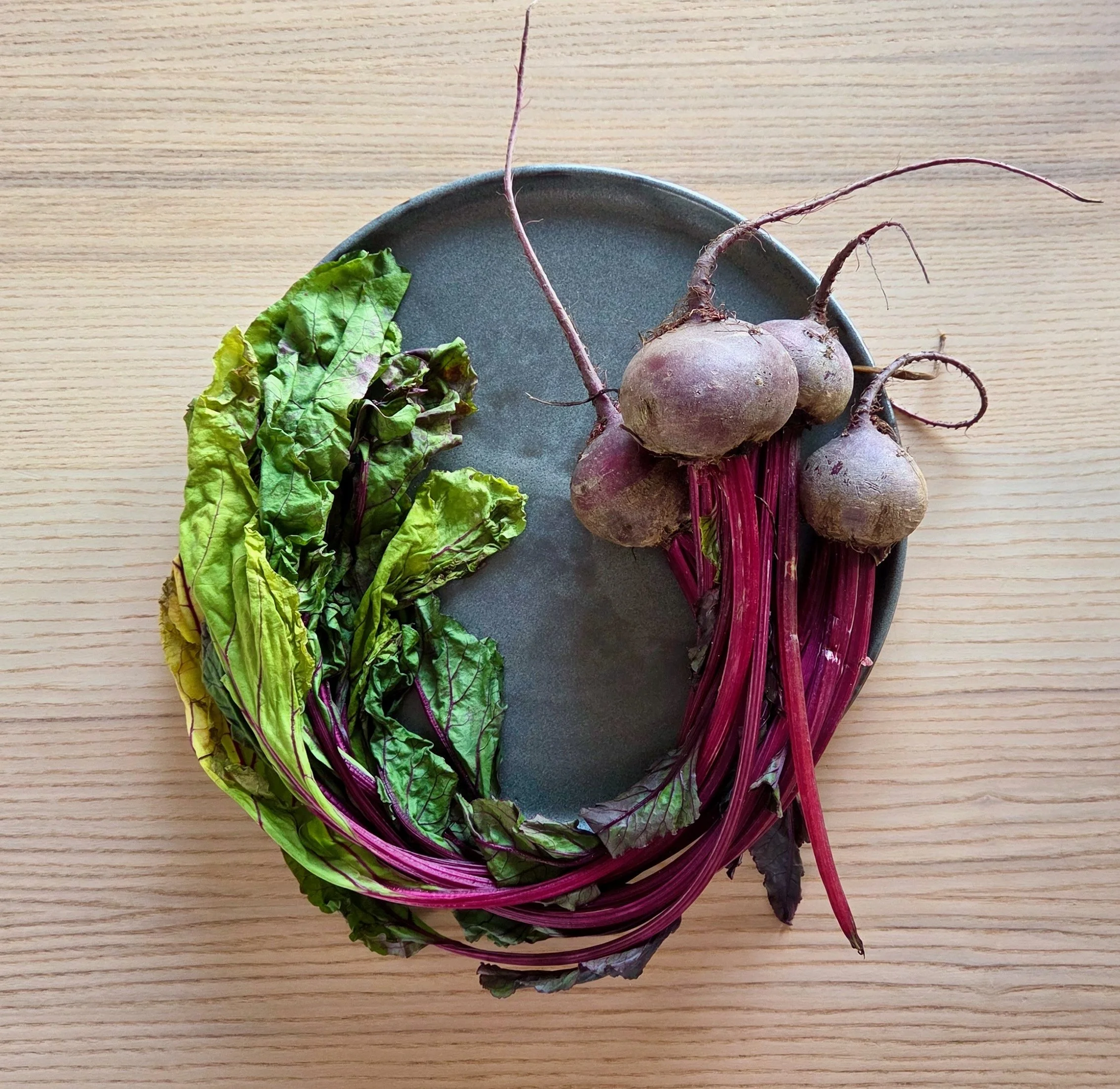 beets on a handmade gray plate photographed from above