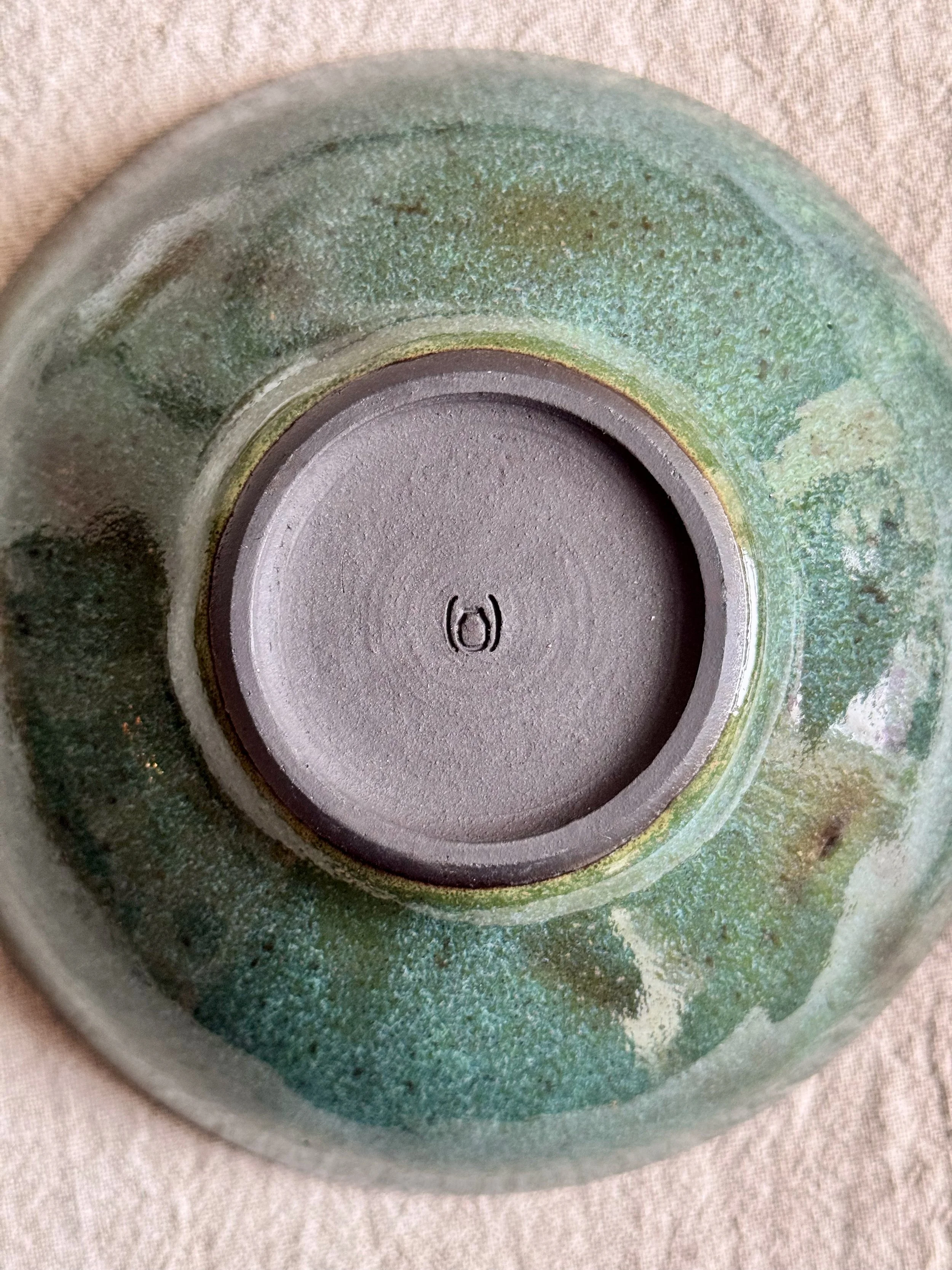 footring of a handmade ceramic bowl with Parenthetical Ceramics logo