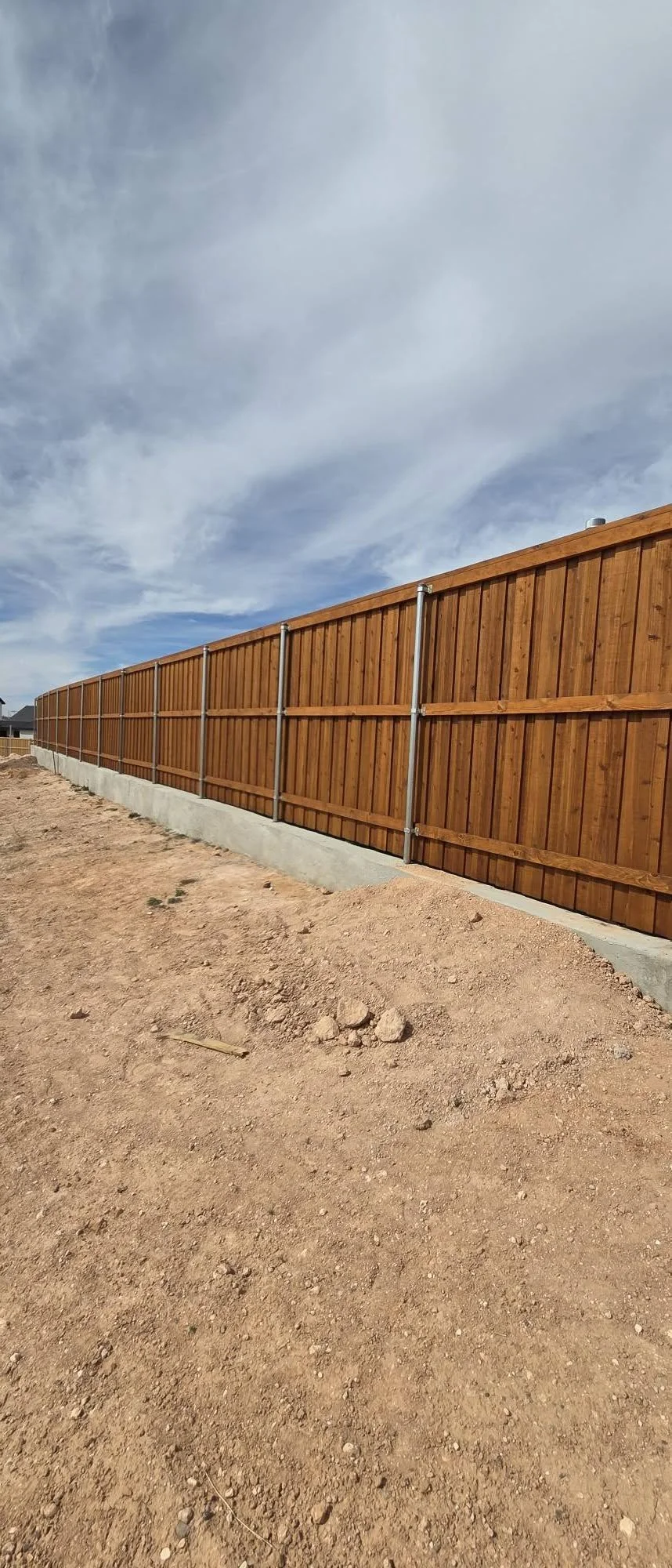 Staining 256' of Board-on-Board in The Trails at Tascosa