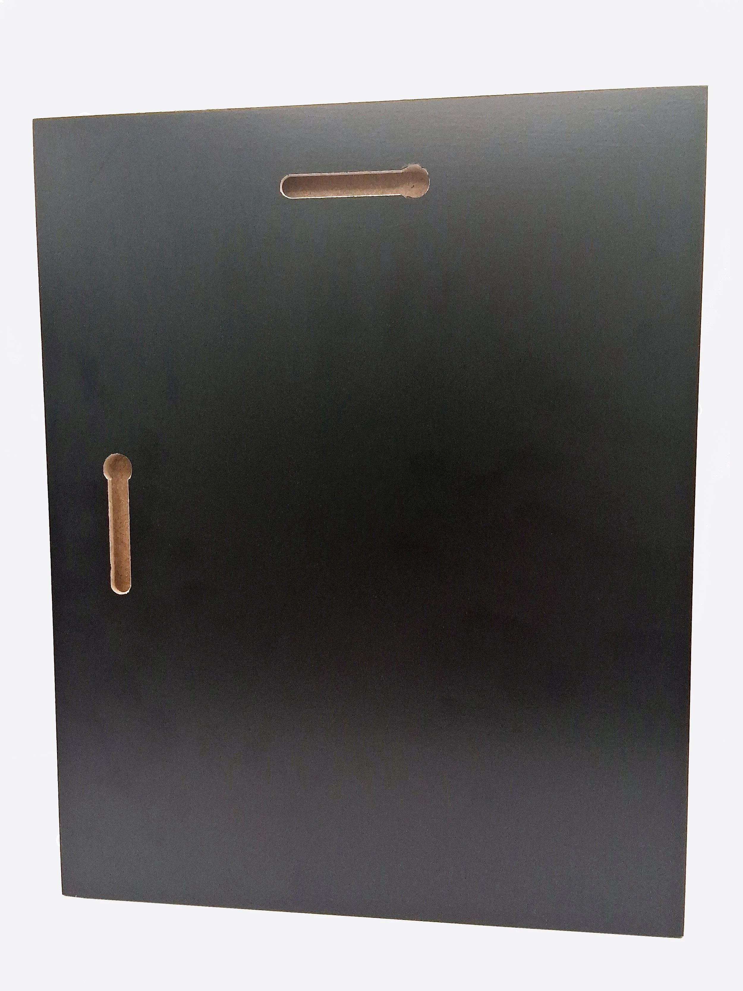 Close-up of a black foam board with a small slot and a hole, possibly part of a crafting or construction project.