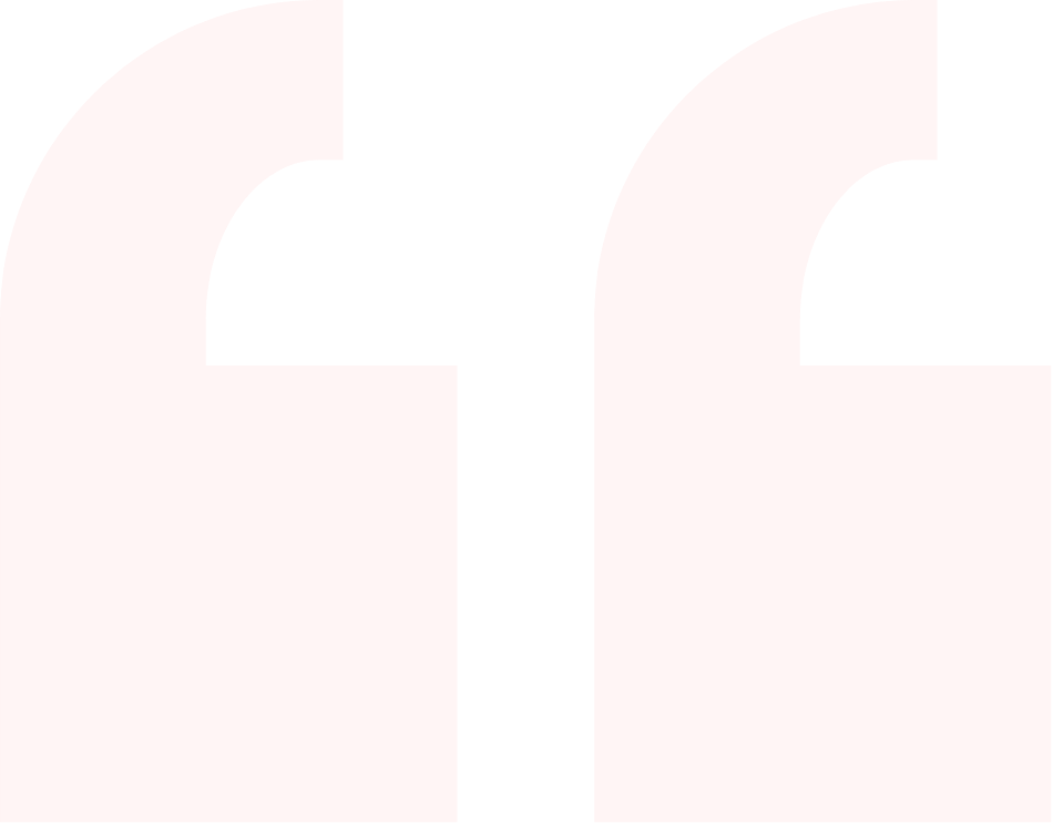 Close-up of a large quotation mark on a pale pink background.
