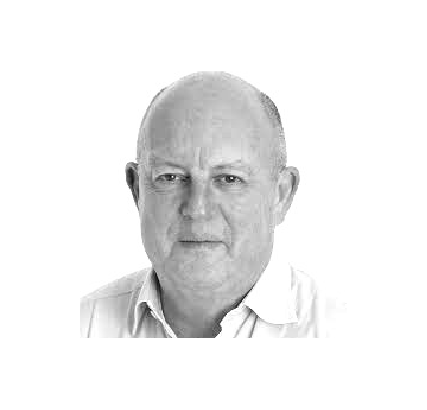 . Man in white shirt, against a white background. Sam Clarke