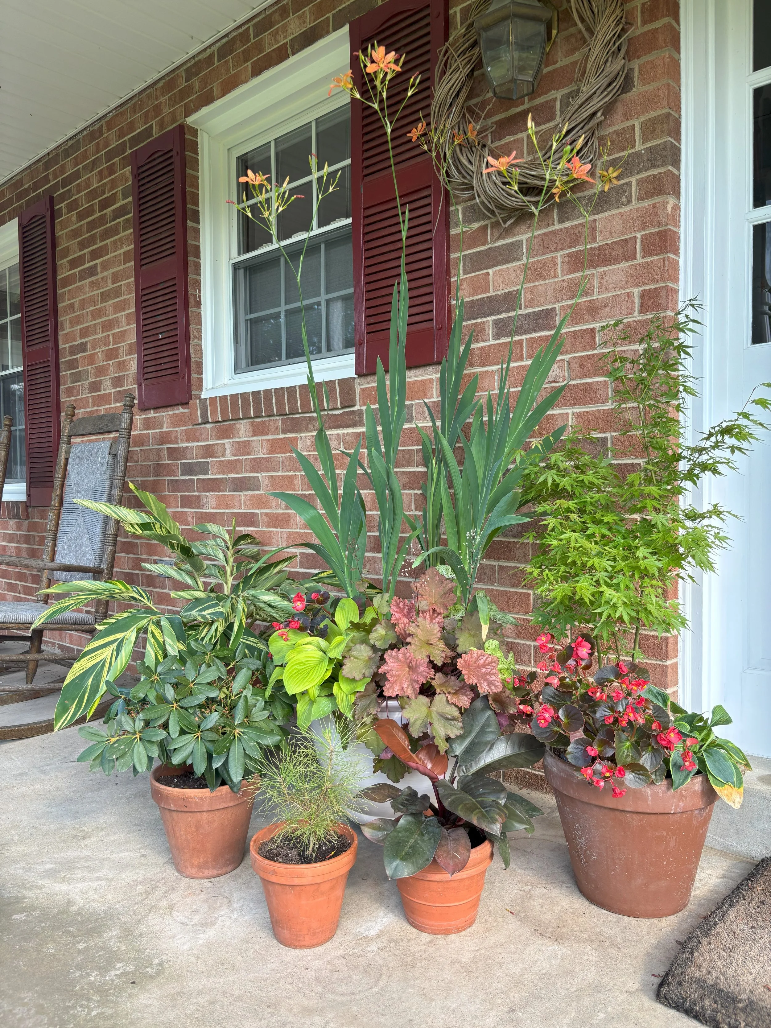 Porch Containers Complement the Brick