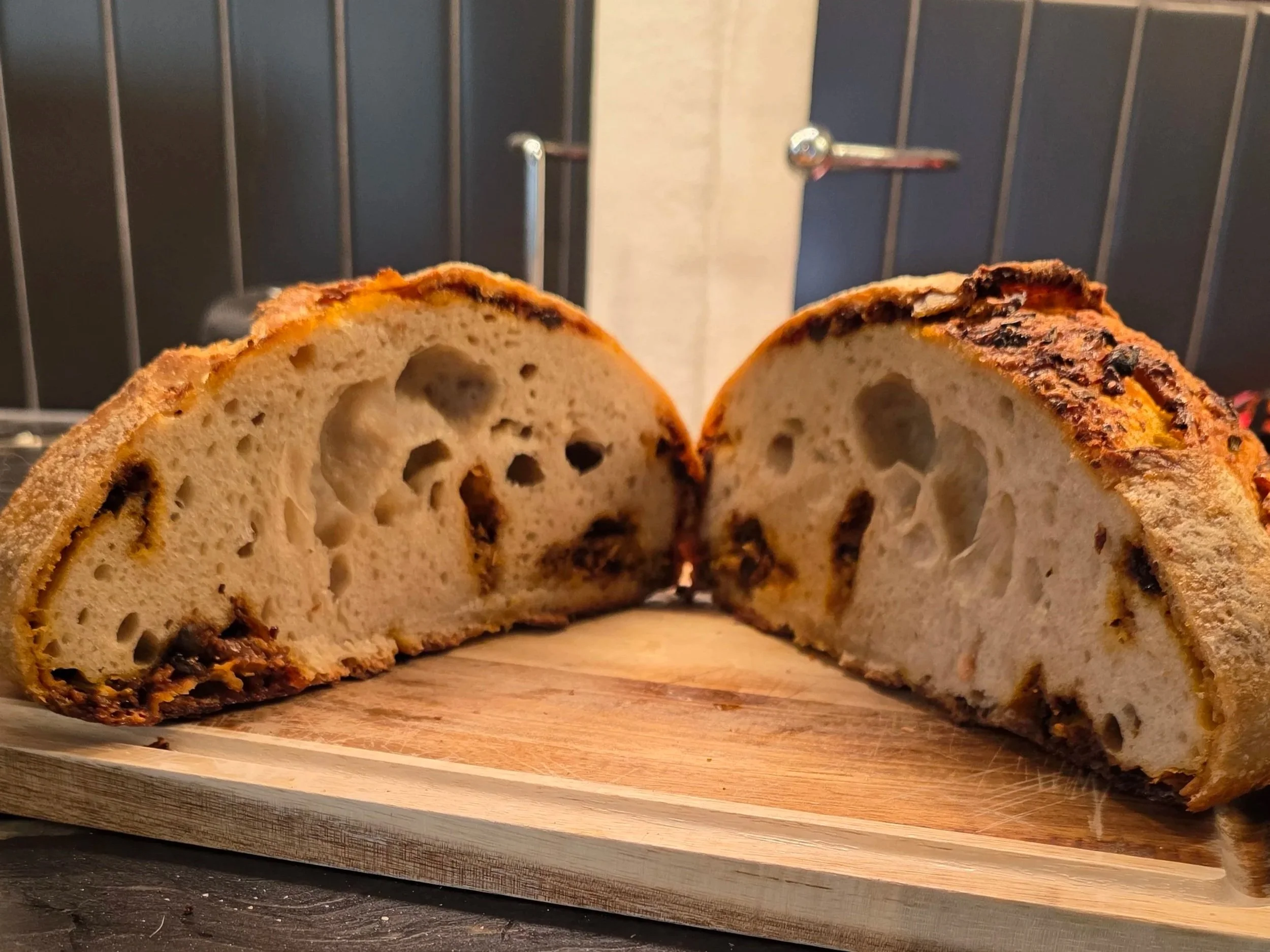 Cross section of artisan sourdough bread showing open crumb structure from fermentation
