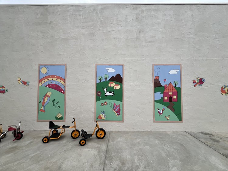 Murals and ride-on toys in the yard
