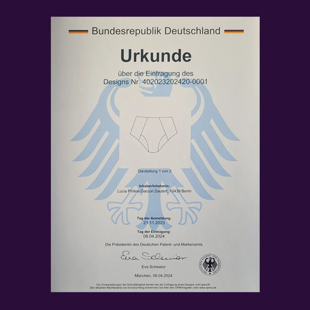 Deutschland Wappen mit schwarzer Adler auf goldener Fahne, darüber der Text "Bundesrepublik Deutschland", darunter eine Urkunde mit Designnummer, Name, Adresse, Daten und Signatur.