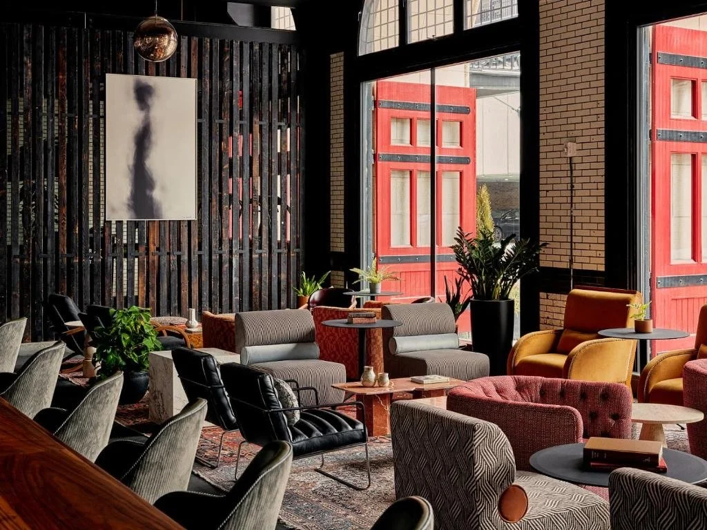 A modern hotel lobby with chairs.